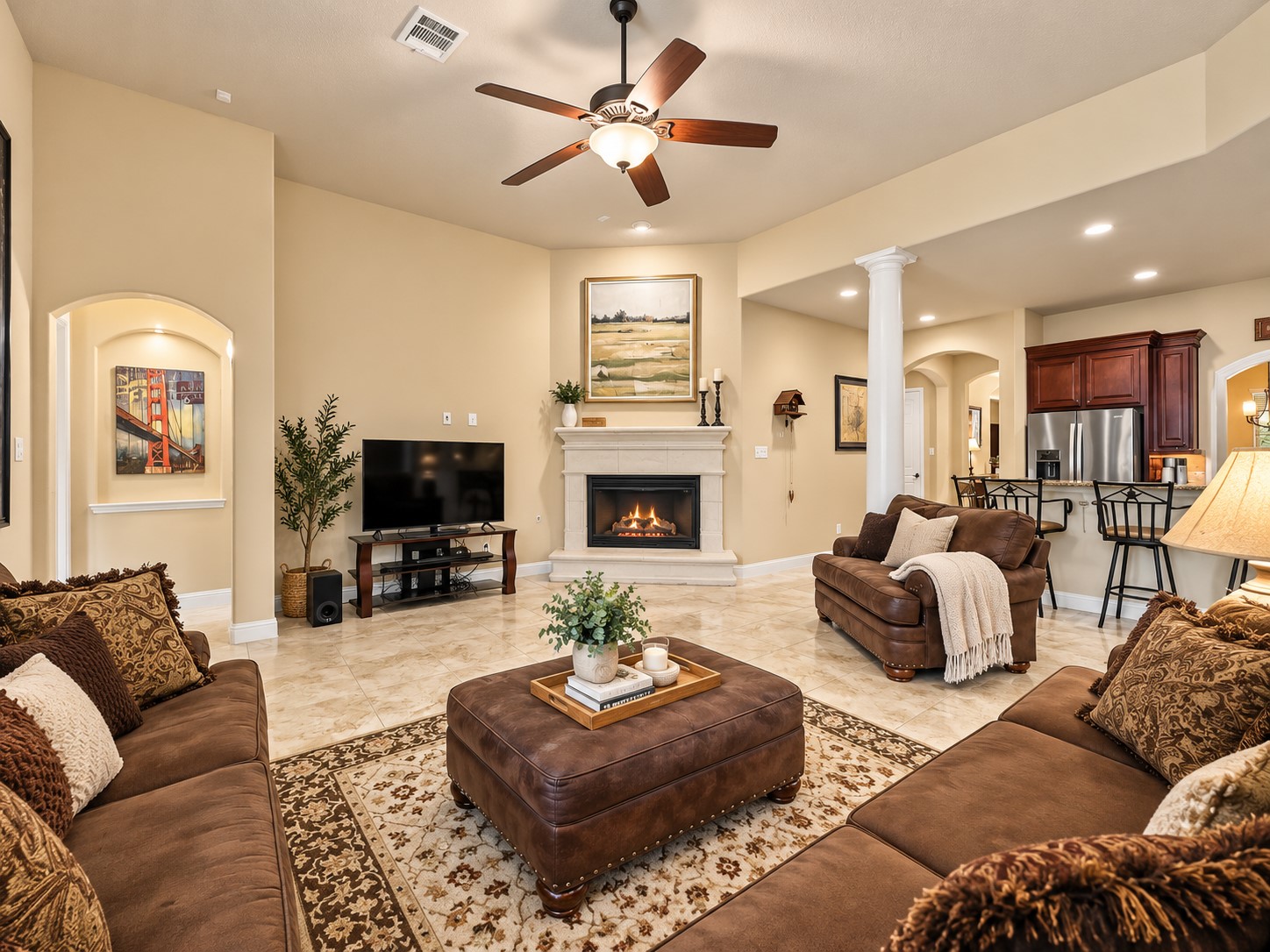 Enjoy a living room that brings the outdoors into view while keeping you connected to the kitchen and dining areas. Settle in by the fireplace and enjoy a relaxing evening with family while the backyard views provide a beautiful backdrop.