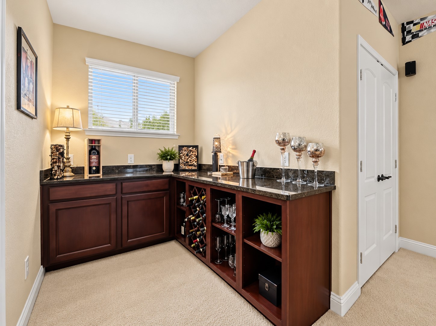 The custom built-in bar area in the upstairs game room adds a nice touch to this already perfect game room/movie room space. From game day with friends to a relaxed movie night, the built-in bar makes the upstairs game room even more ready for entertaining.