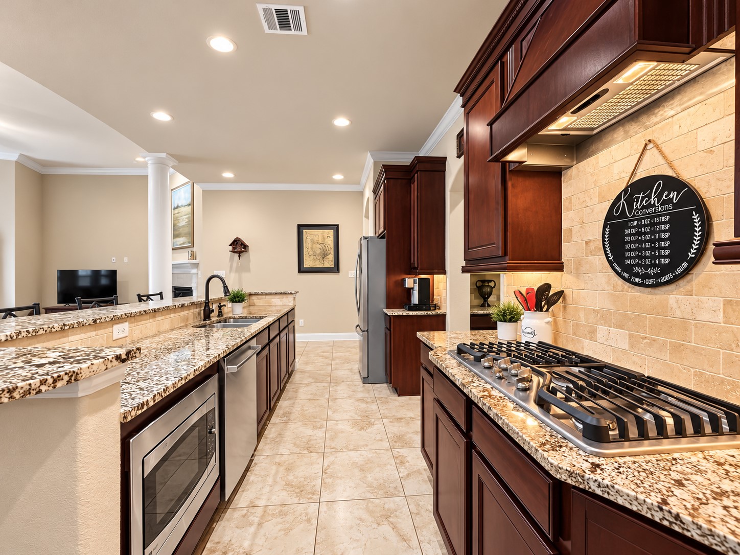 With generous cabinet storage and abundant counter space, this kitchen makes meal preparation and entertaining feel effortless.