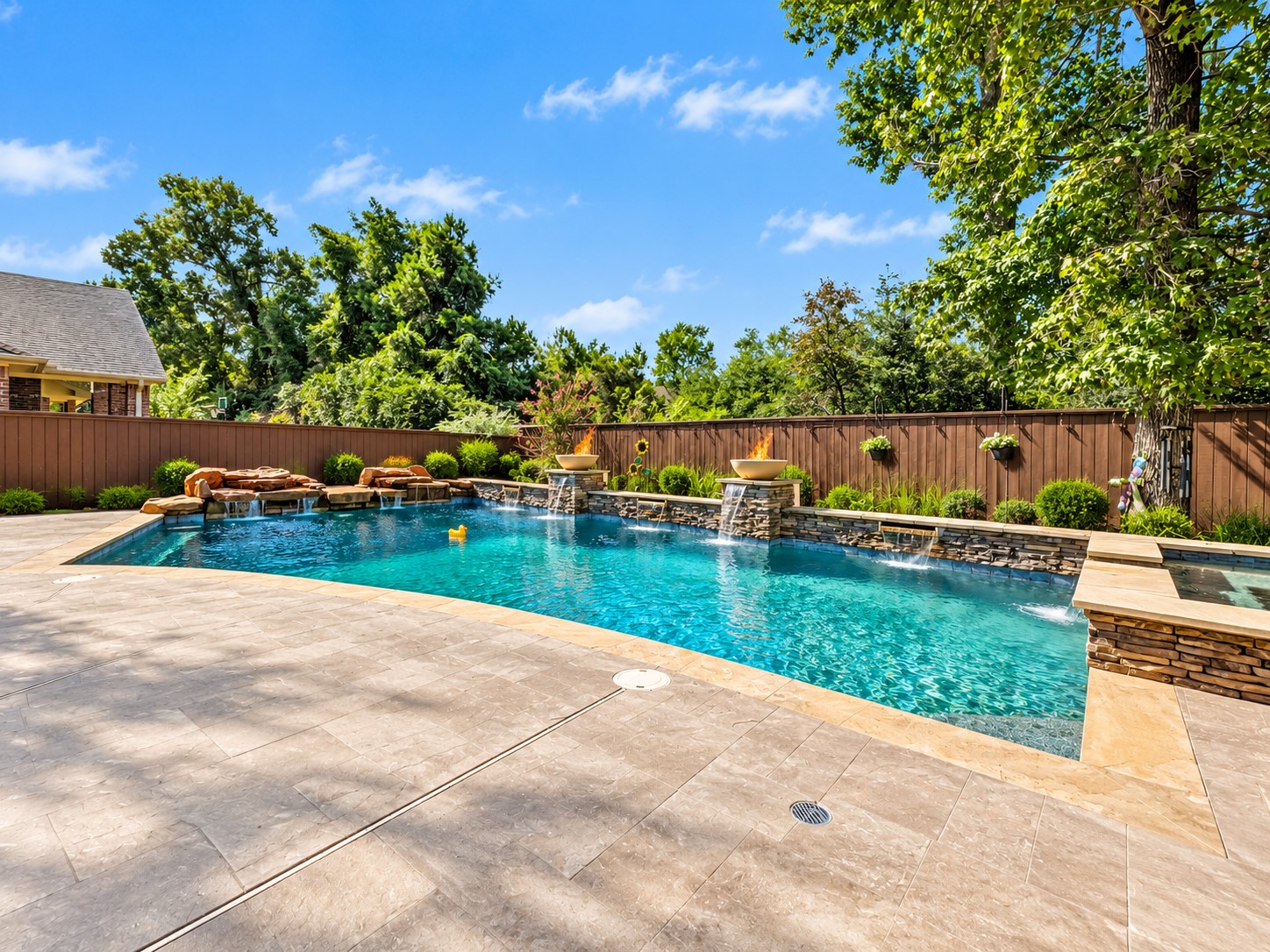 A private outdoor retreat awaits, offering a place to cool off during warm Texas days or unwind in the spa after a busy week.