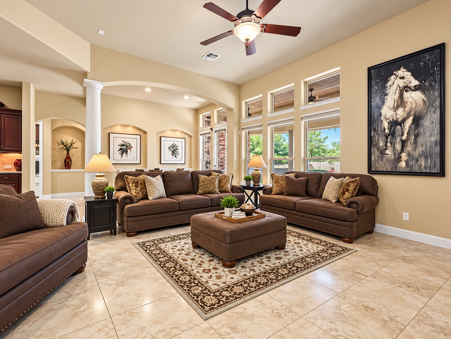 Surrounded by windows, the living room fills with natural light and offers beautiful views of the backyard pool and spa. Whether enjoying your morning coffee or relaxing at the end of the day, the backyard views add to the appeal of this inviting living space.