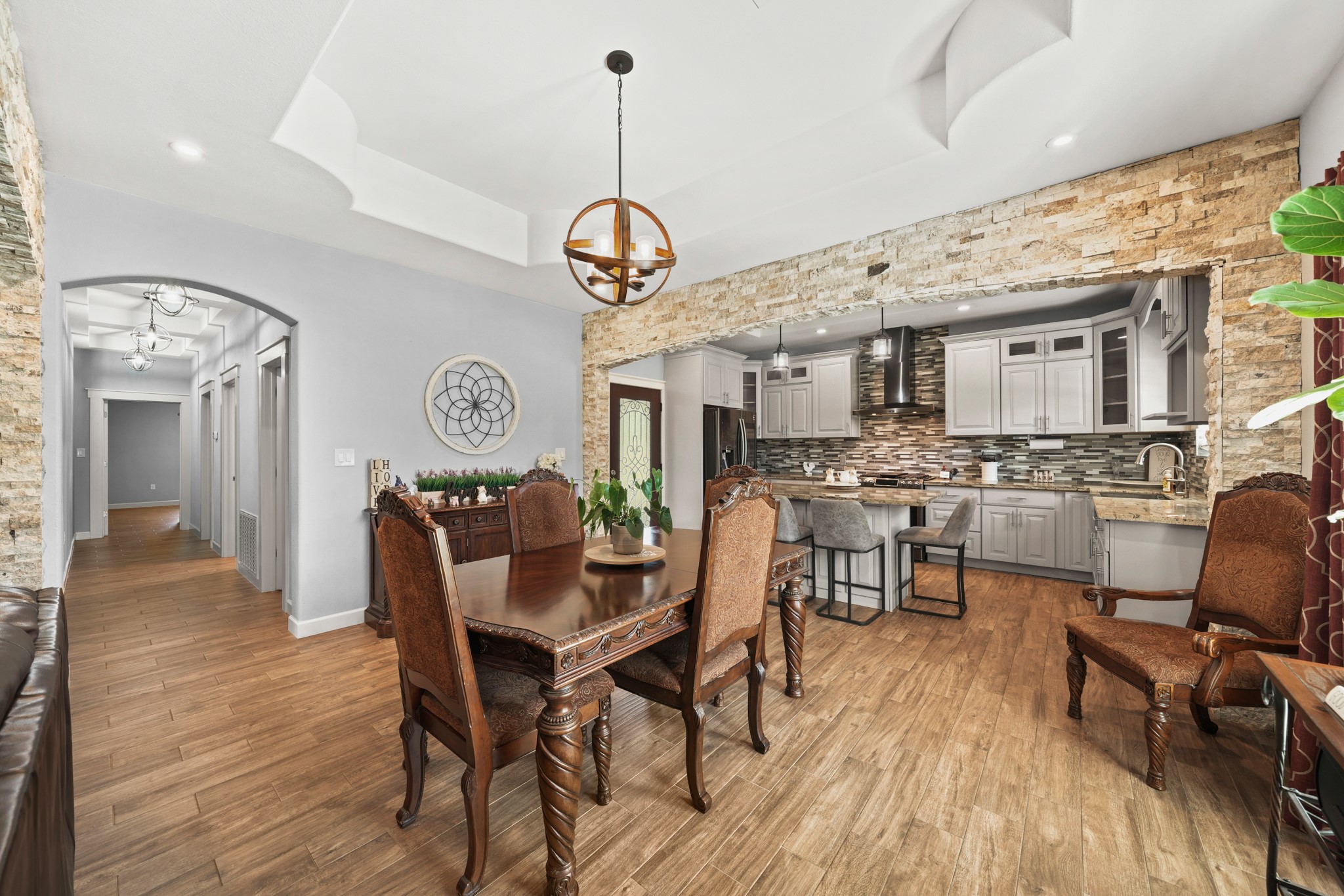 Formal Dining: Perfectly frames the dining table flowing into the kitchen workspaces