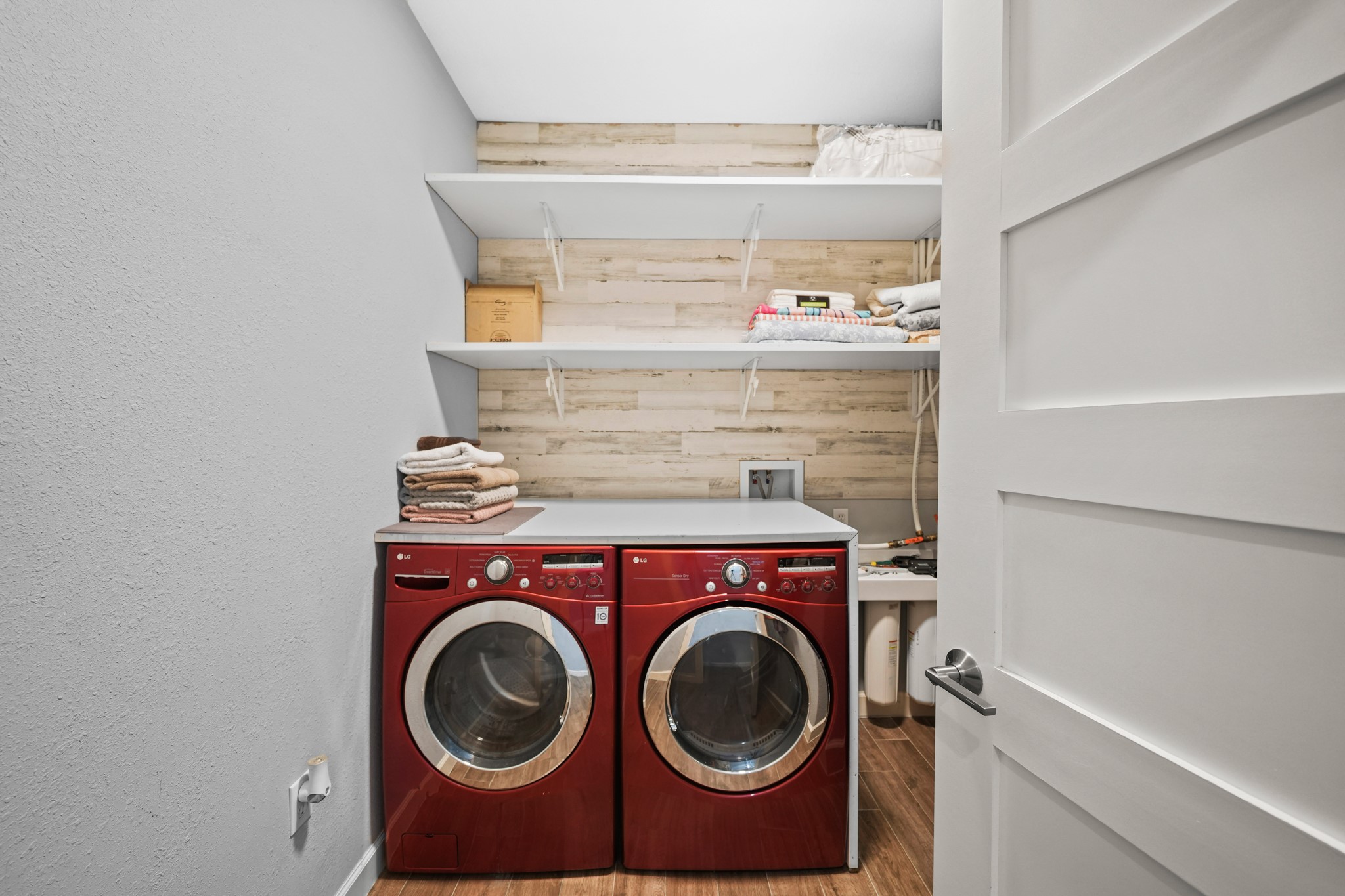 Laundry Room: Practical shot showing the dedicated utility space and shelving