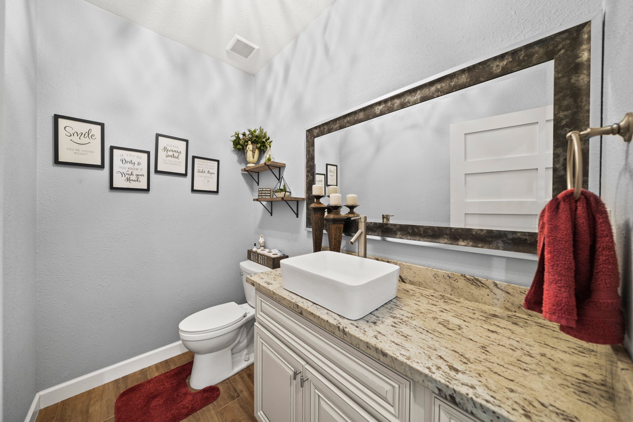 Powder Room: Shows the stylish vessel sink and finishes