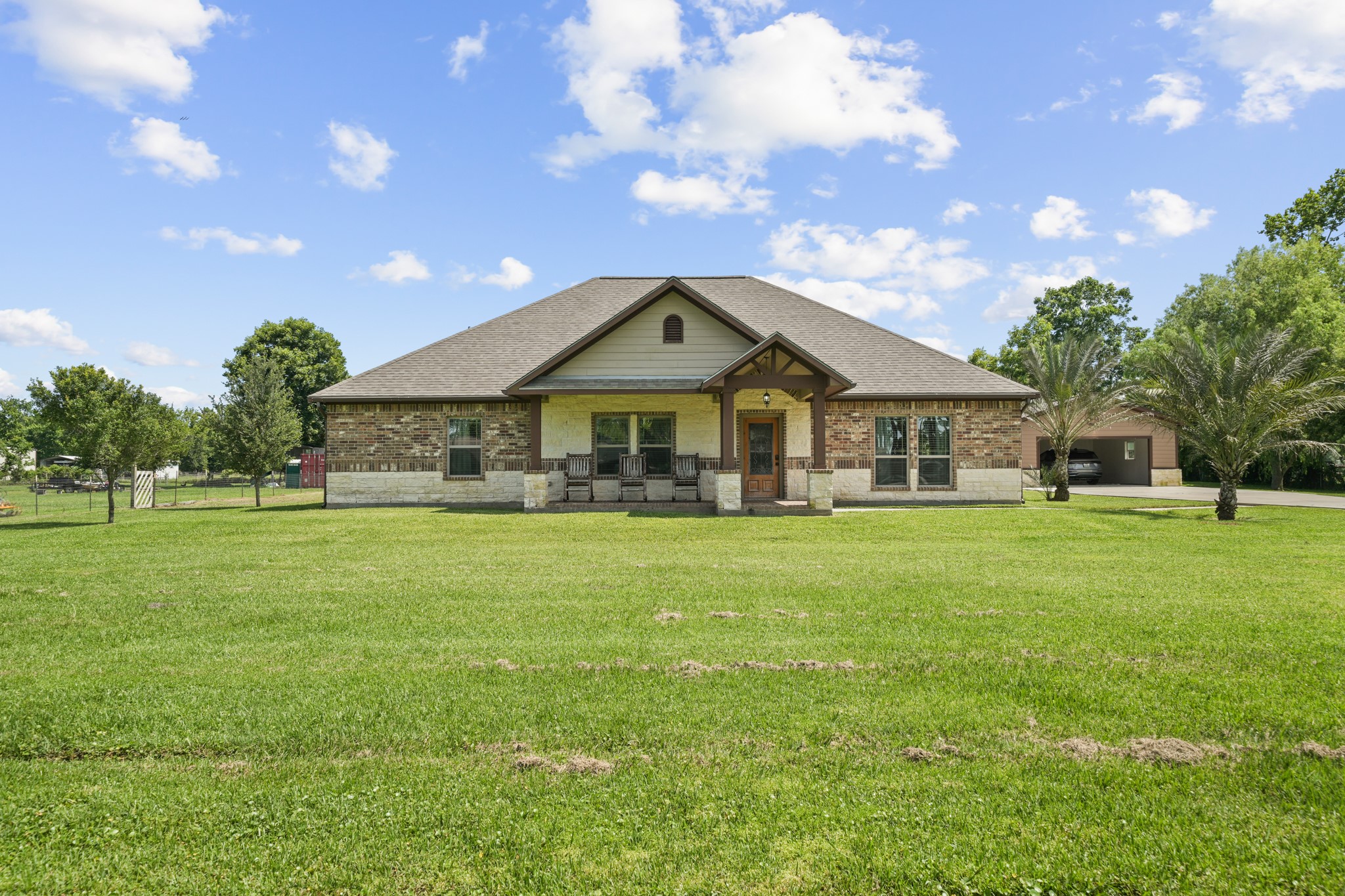 This home features a classic and crisp ground-level front elevation, perfectly centered to welcome you with charm and elegance.