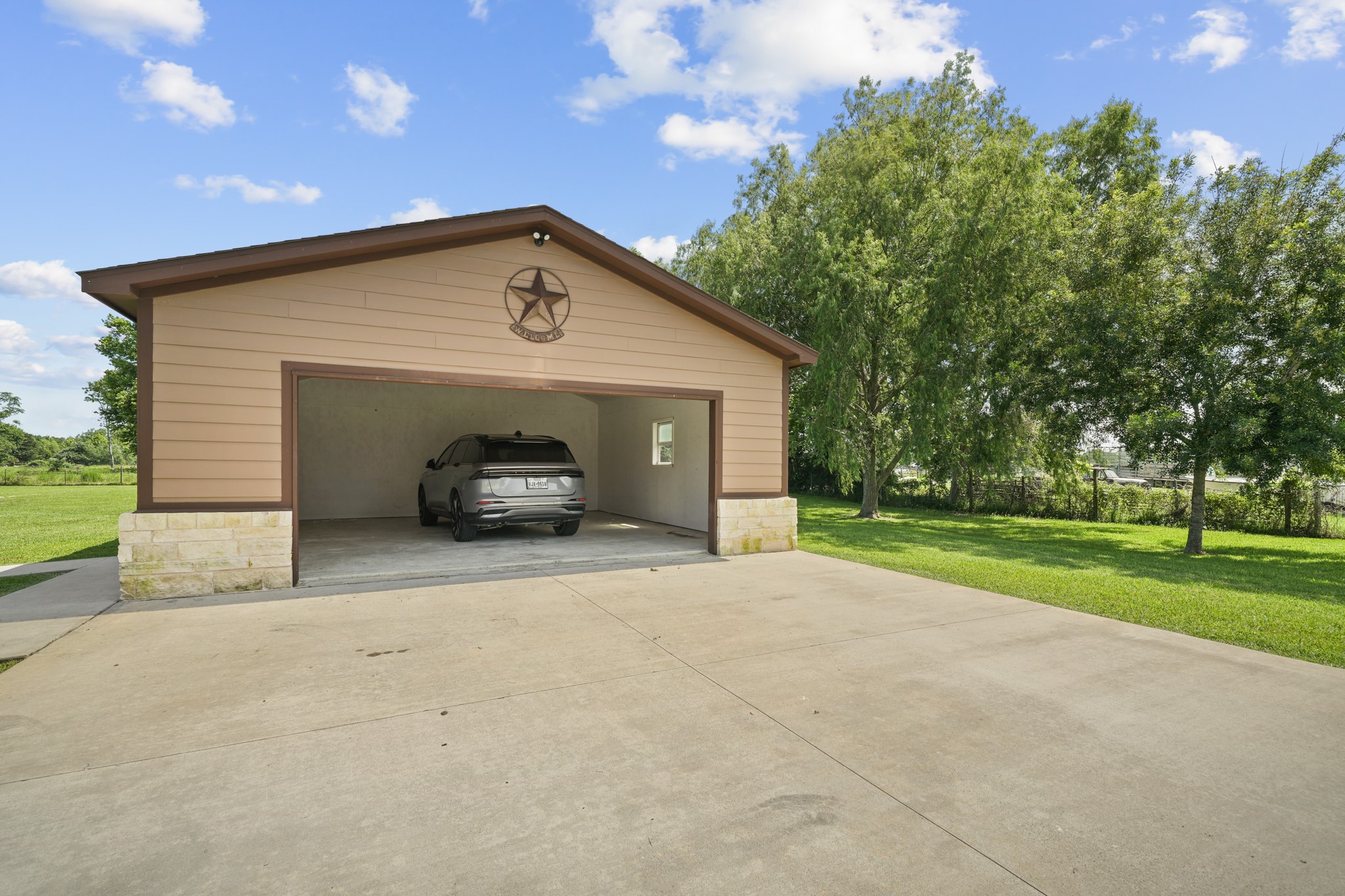 Detached Garage: Best angle showing the interior space and exterior condition of the workshop