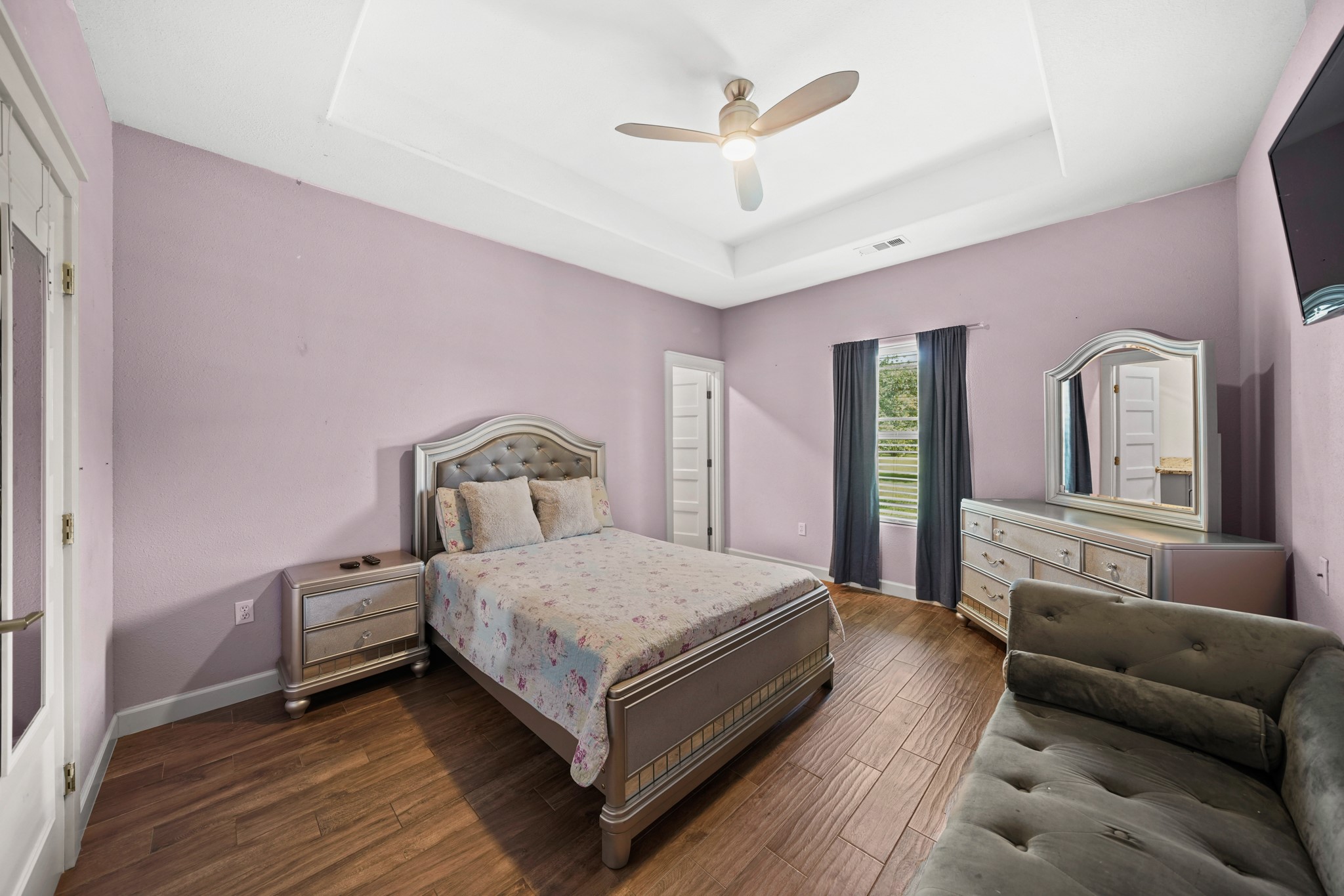 Secondary Bedroom 1: Shows the tray ceiling and room size