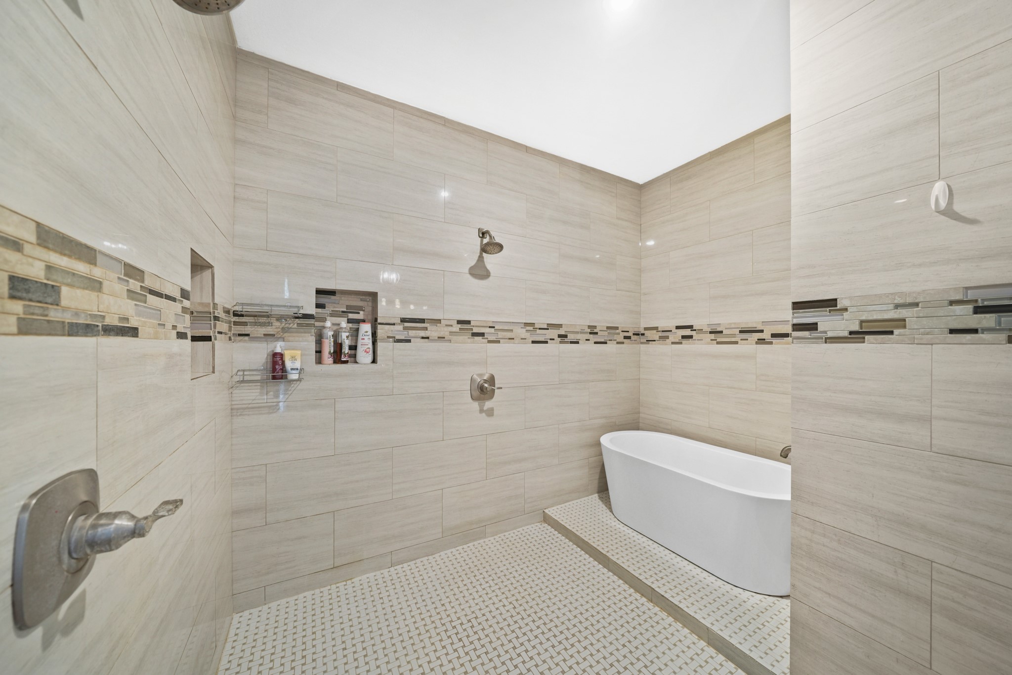 Shower/Tub Detail: A crucial shot highlighting the unique soaking tub situated inside the massive tile shower enclosure