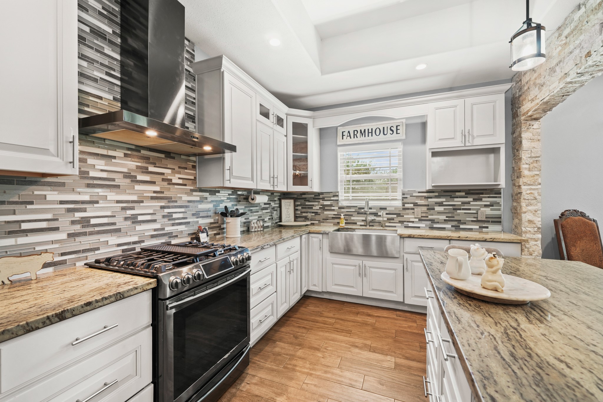 Kitchen Work Zone: The absolute best angle to show off the custom mosaic backsplash, vent hood, and pro-style range