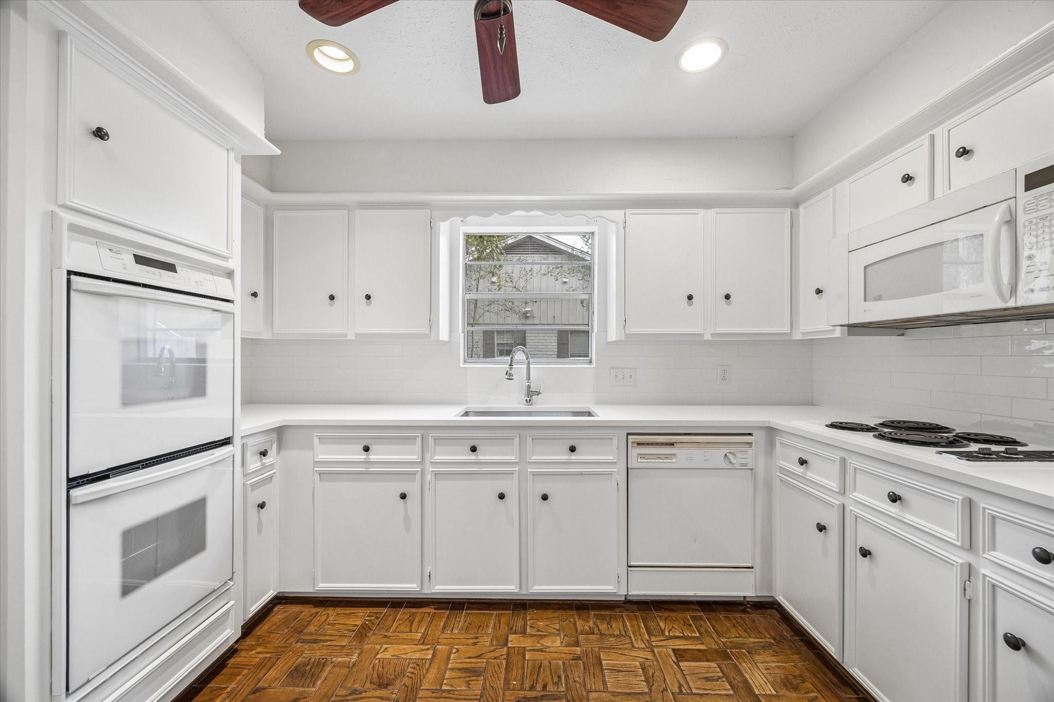 The kitchen has just been been updated with new quartz countertops and new paint.