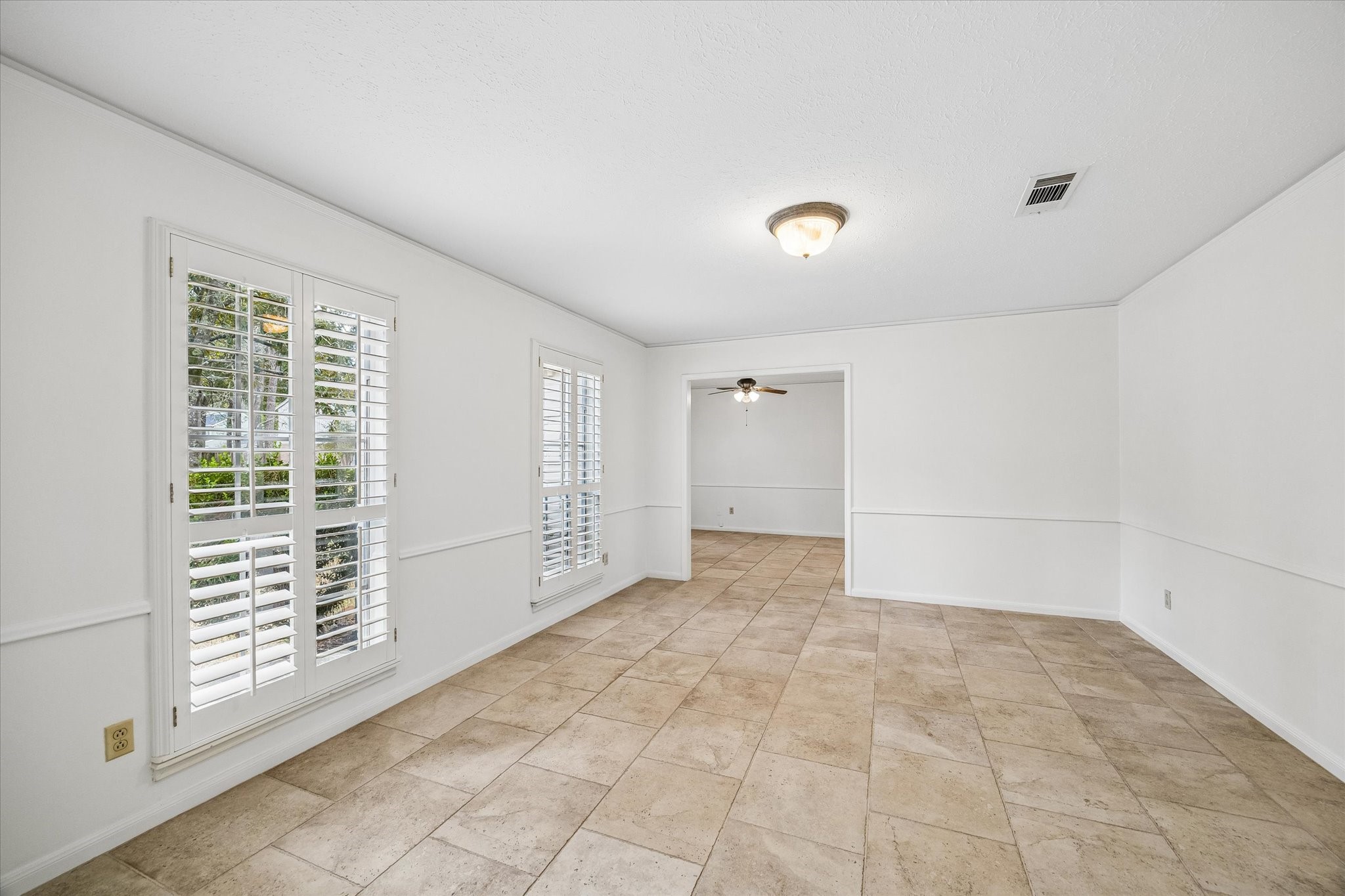 This large front room can be a flex room for Home office, additional family room or game room.