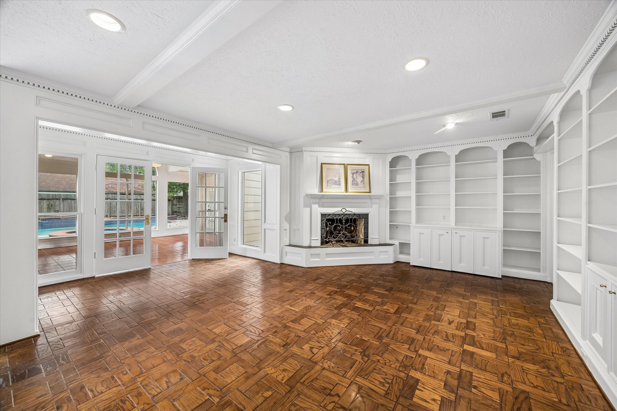 The large family room has custom built in cabinetry
