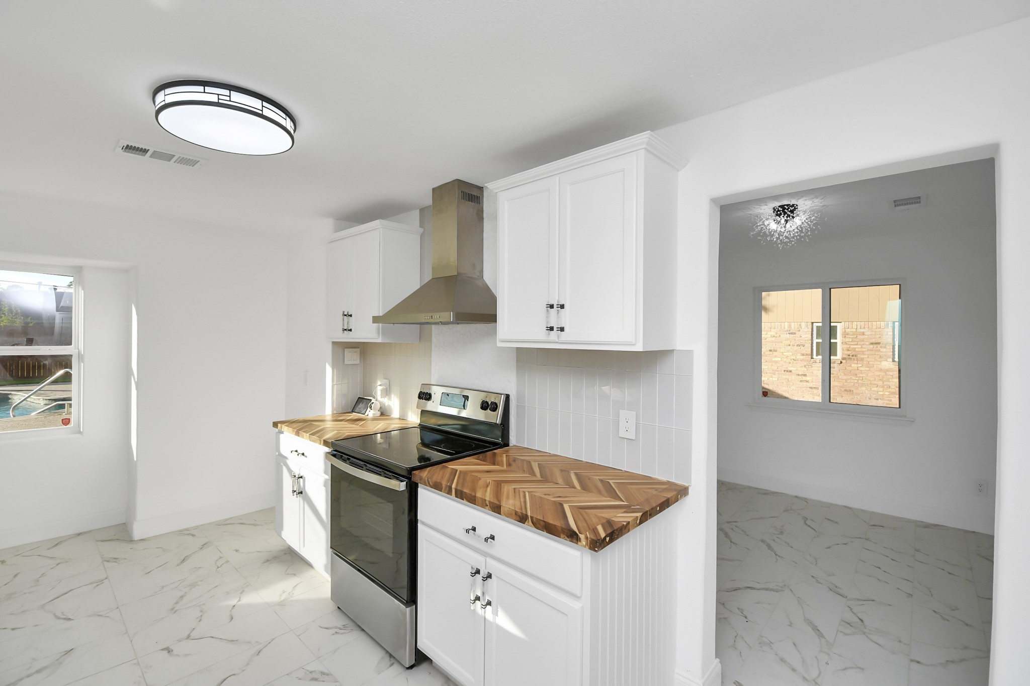 The dining room is conveniently located next to the kitchen, making entertaining effortless