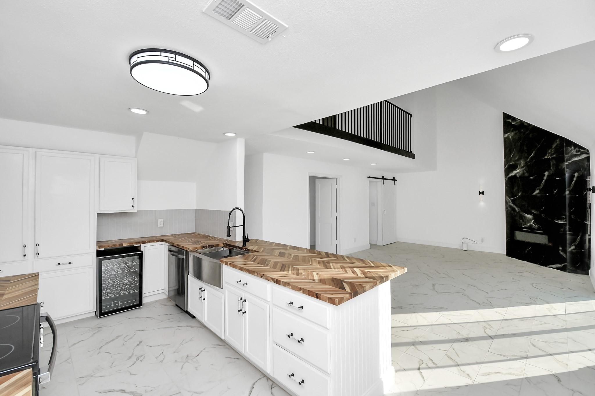 The kitchen is beautifully equipped with sleek modern finishes, yet fully prepared to meet the needs of any chef.