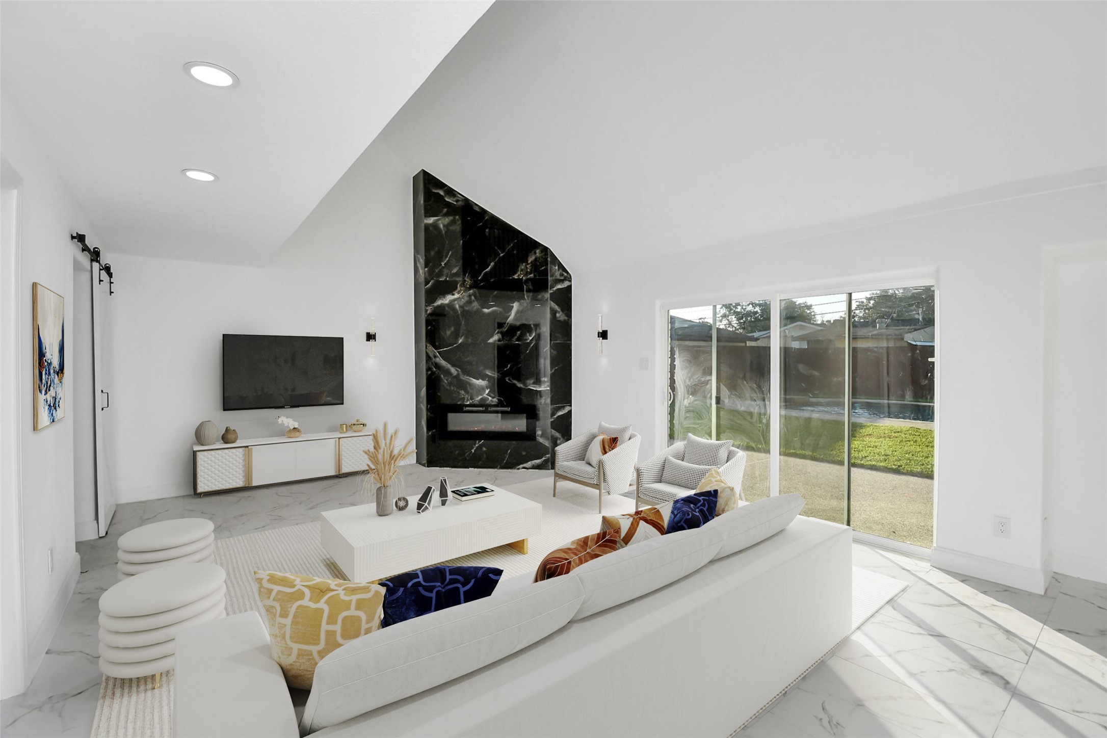 A modern den features soaring vaulted ceilings and a striking black marble accent wall, complemented by a mounted modern fireplace, making a bold and sophisticated statement. (Virtually Staged)