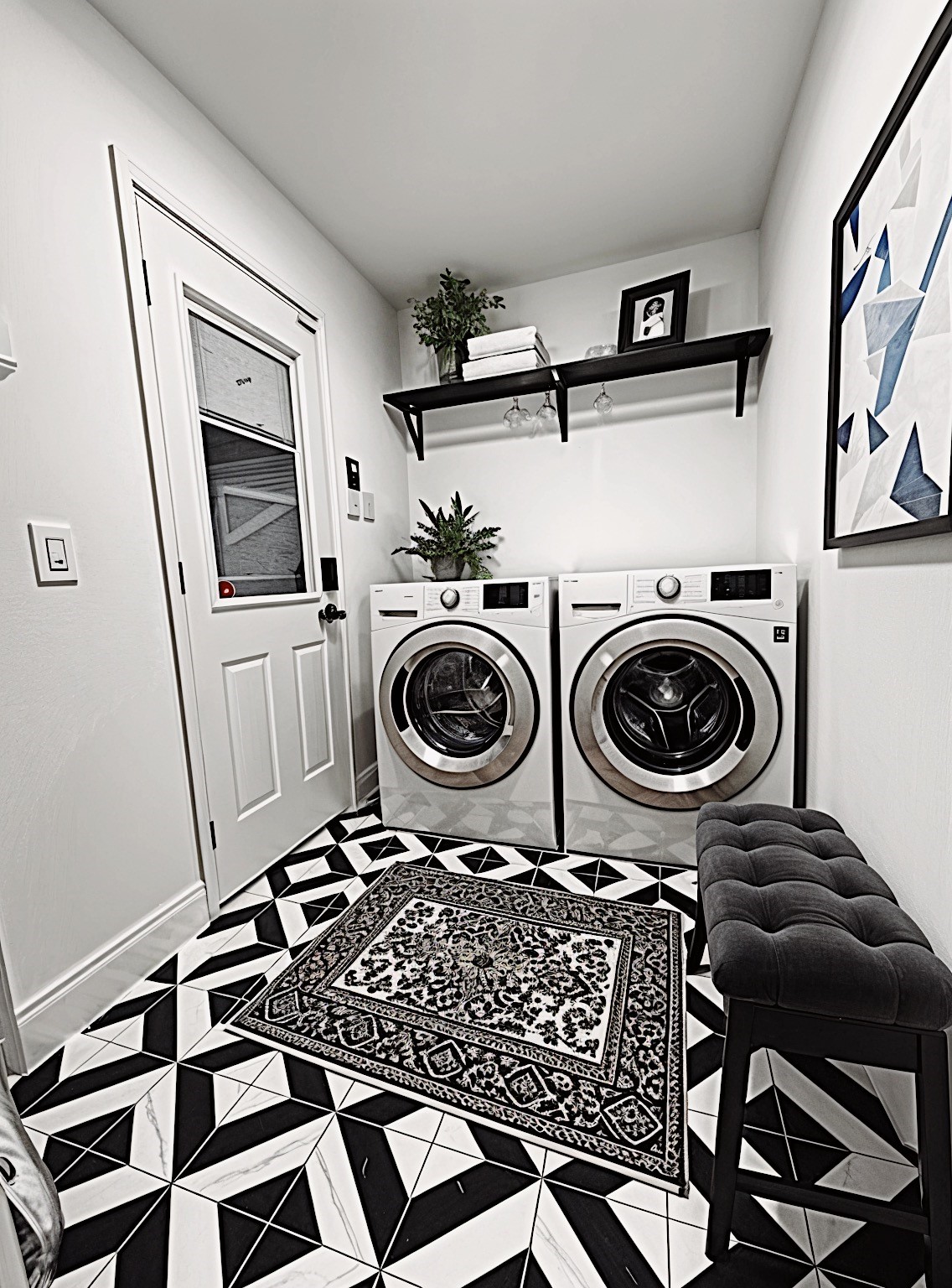 This downstairs laundry room is a delight! What a beautiful workspace. (Virtually Staged)