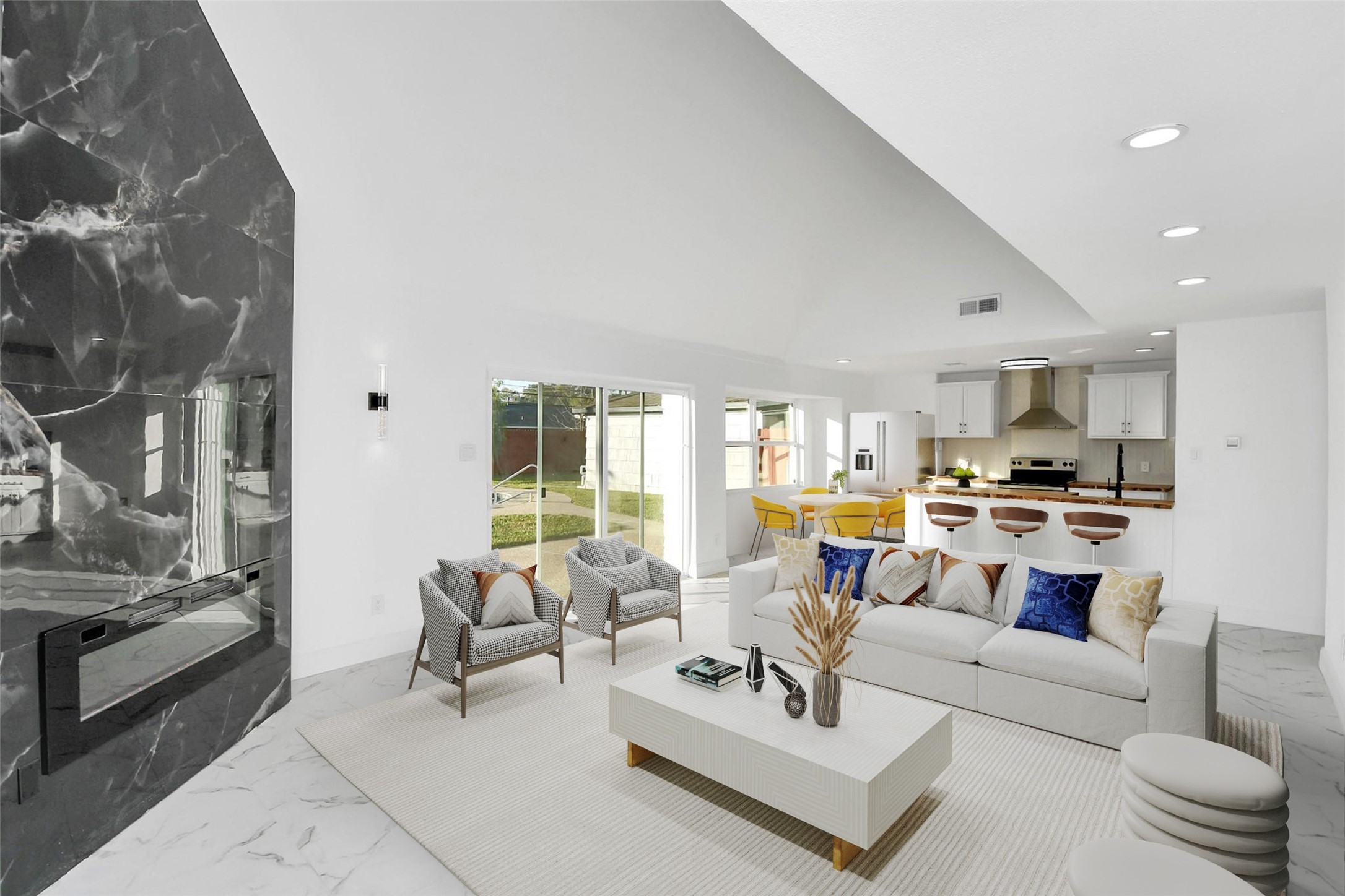 A view of the fireplace reveals its integration with the open-concept layout, offering a perfect flow toward the kitchen areaan ideal setup for entertaining guests. The possibilities in this space are endless. (Virtually Staged)