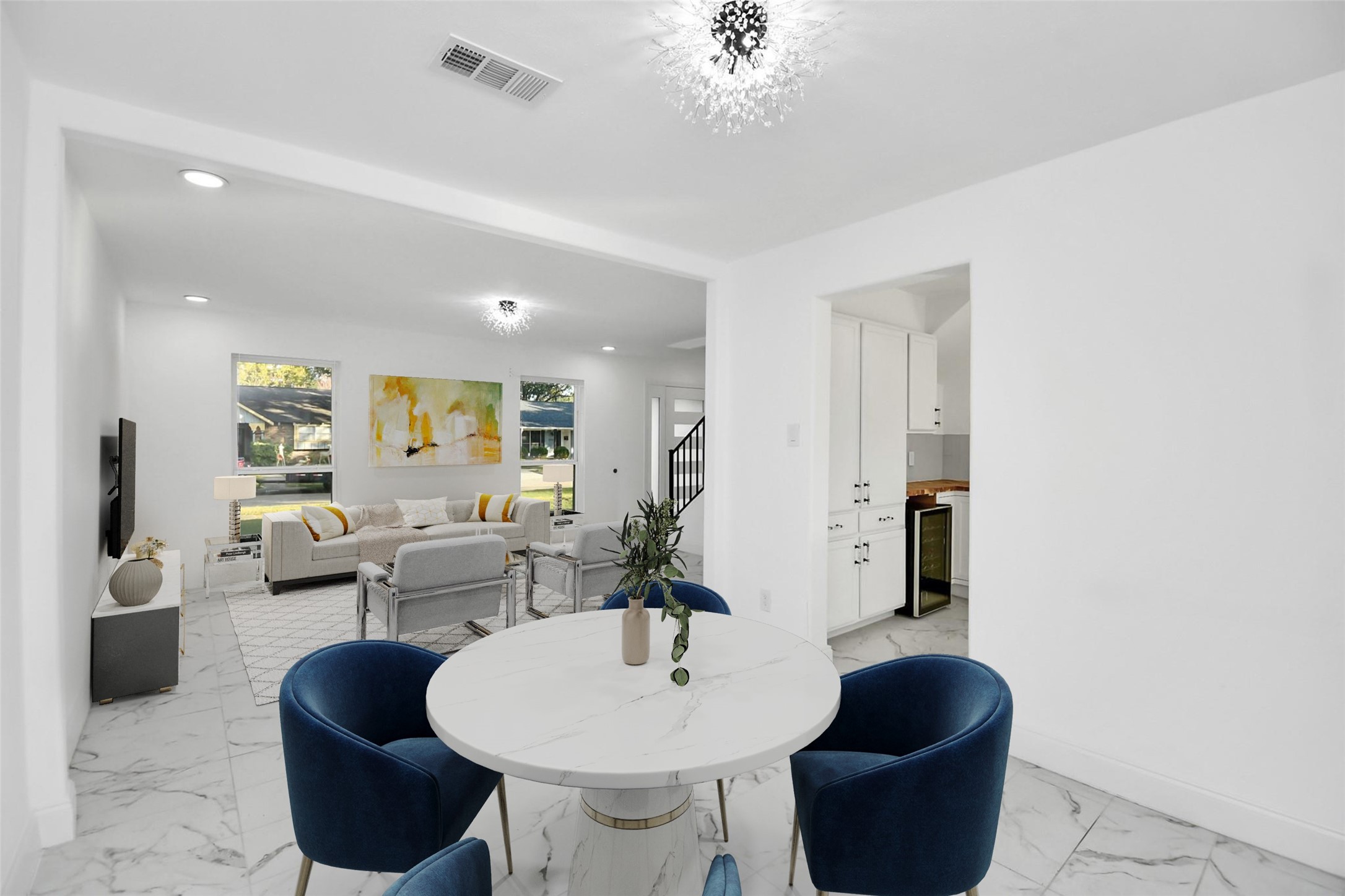 A view from the back of the dining room toward the front of the home reveals numerous possibilities, offering a flexible space that can be tailored to suit your needs and lifestyle. (Virtually Staged)
