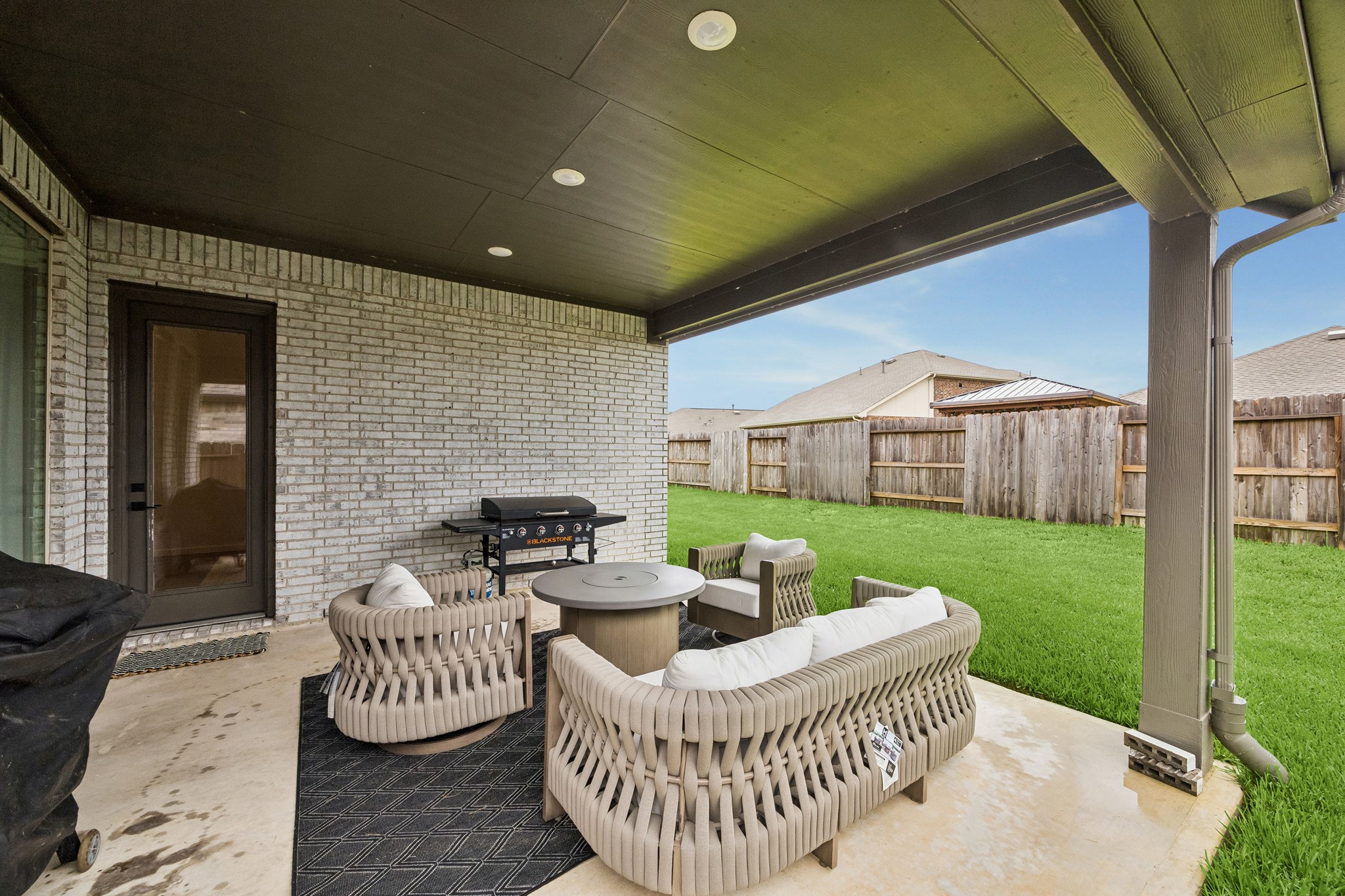 Spacious back covered patio is great for relaxing and entertaining.