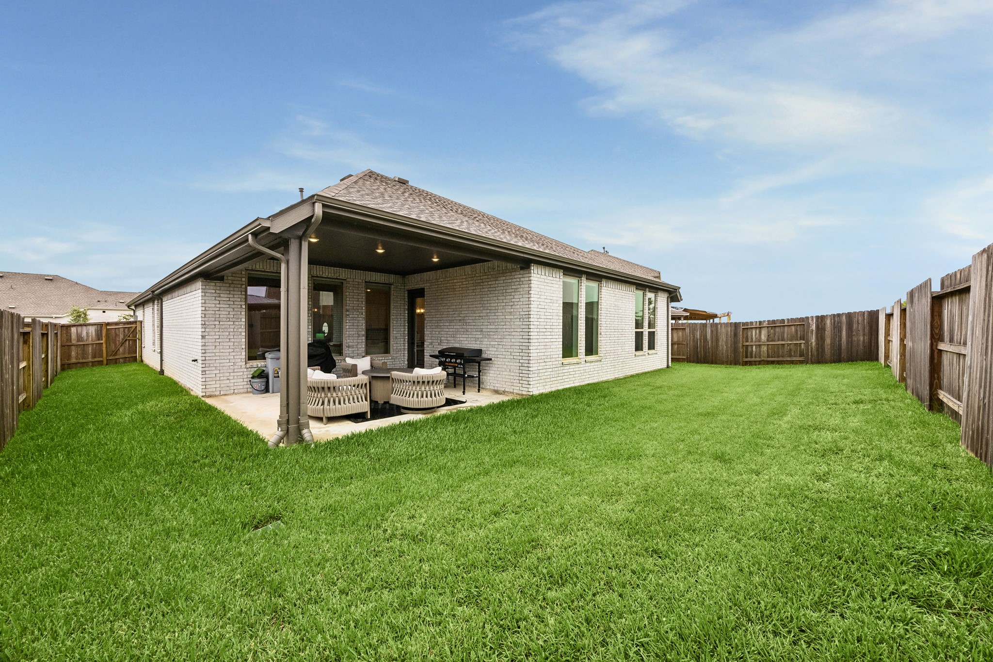 Another view of the back patio which is large enough to grill, entertain and relax.