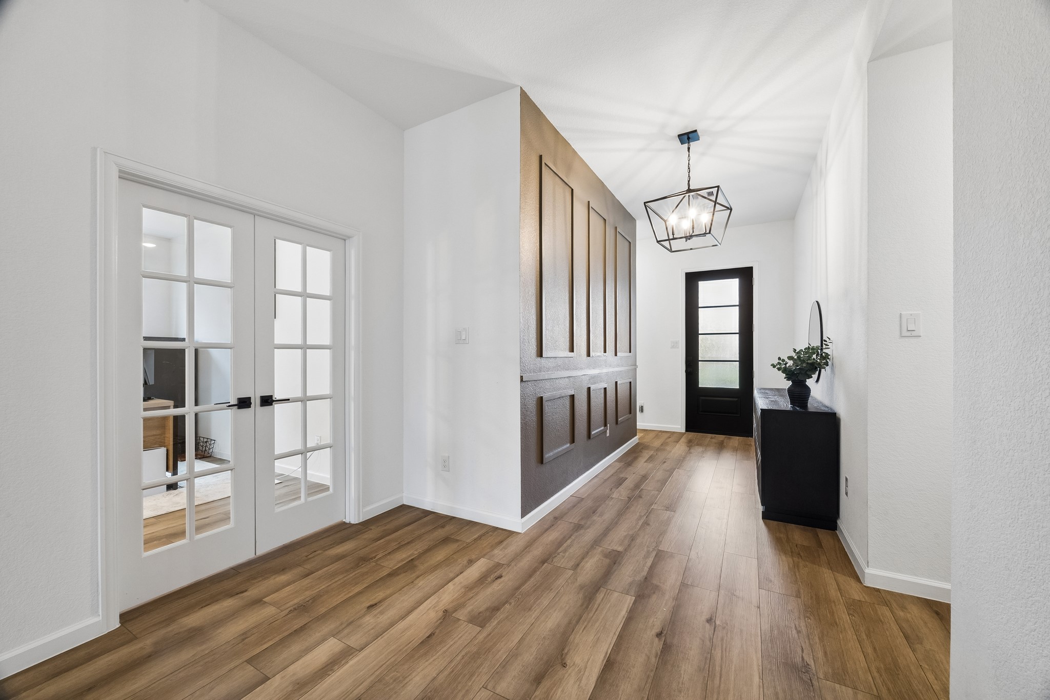 Another view of the entry and study with French doors.