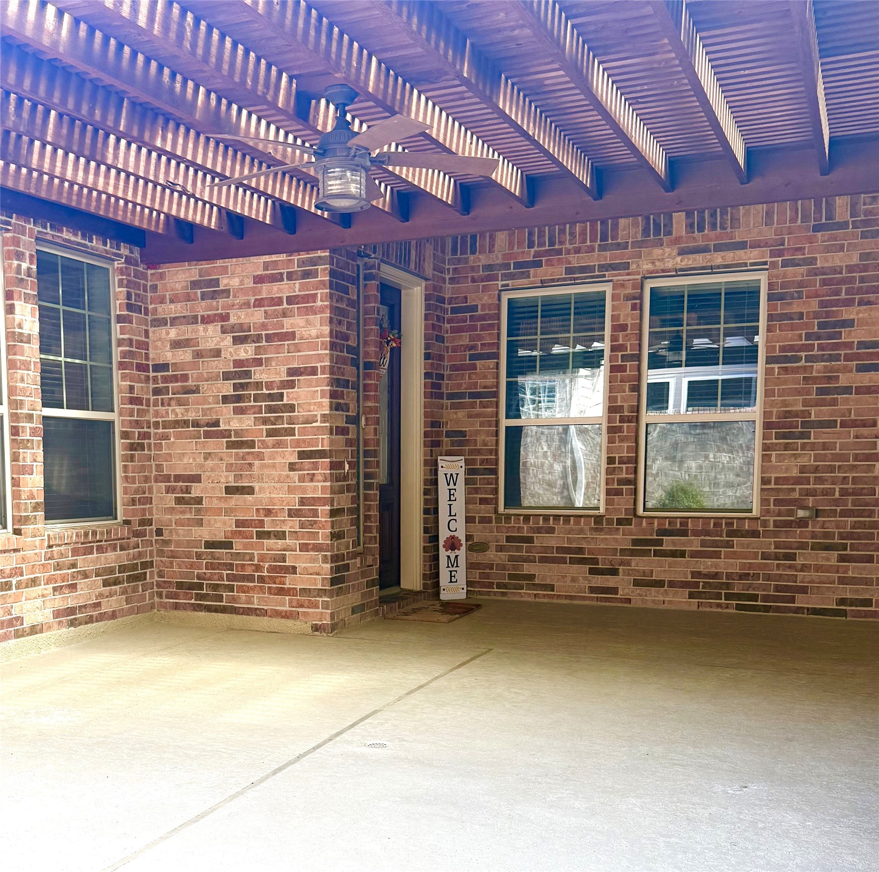 covered front court yard with fireplace