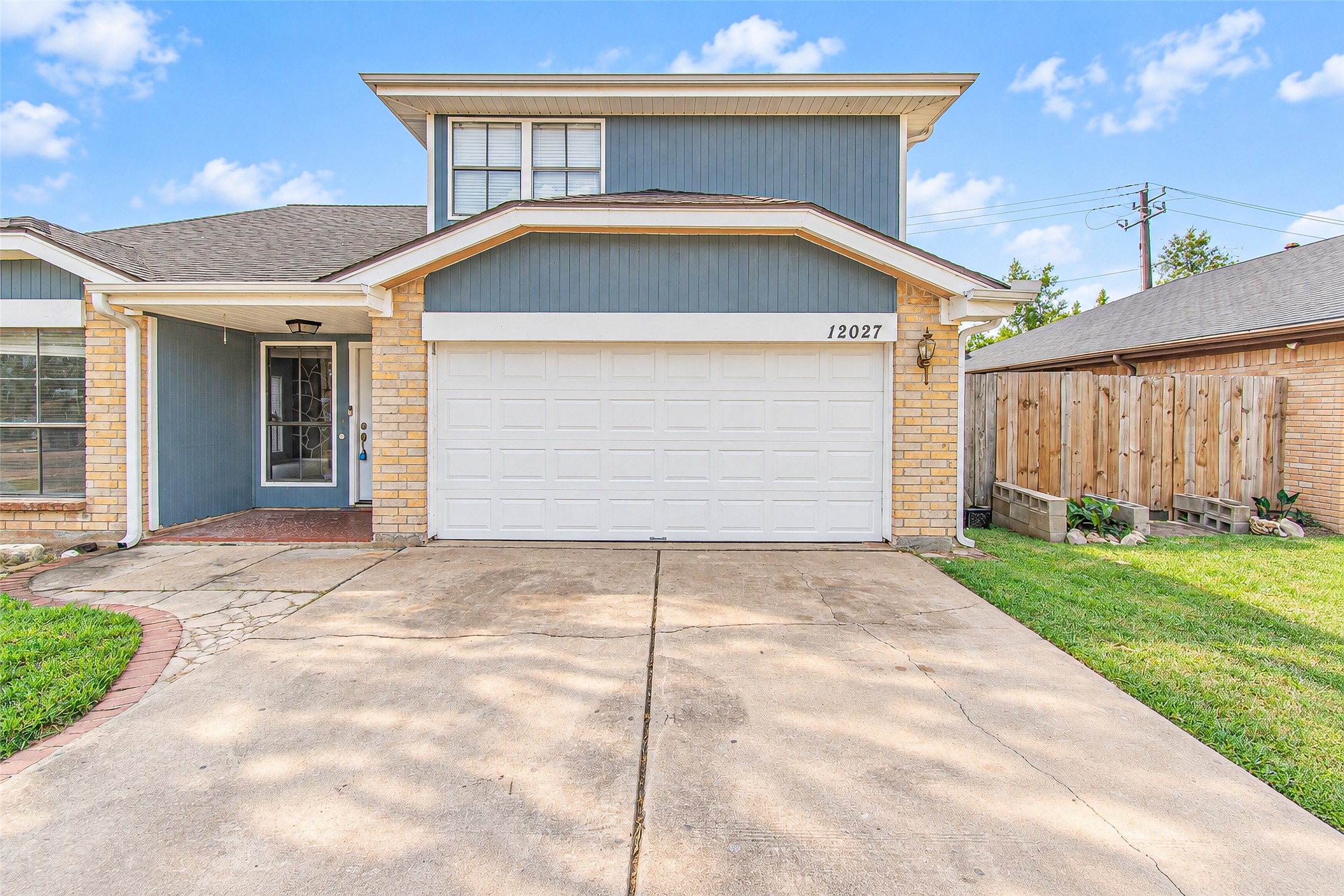 Charming two-story home with a spacious driveway leading to a double garage, featuring a welcoming front entrance and well-maintained exterior. Charming two-story home with a spacious driveway leading to a double garage, featuring a welcoming front entrance and well-maintained exterior.