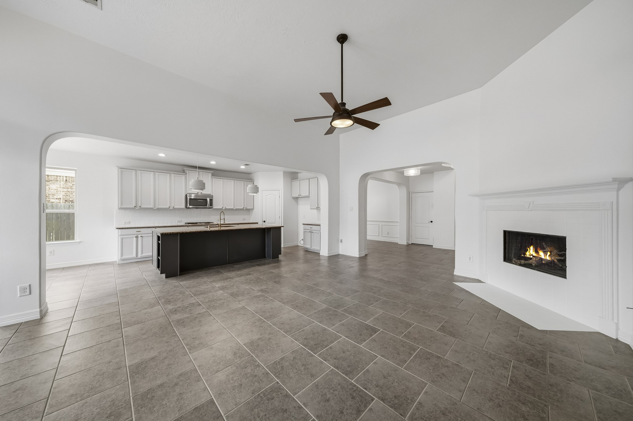 another view of the living room showing the fireplace