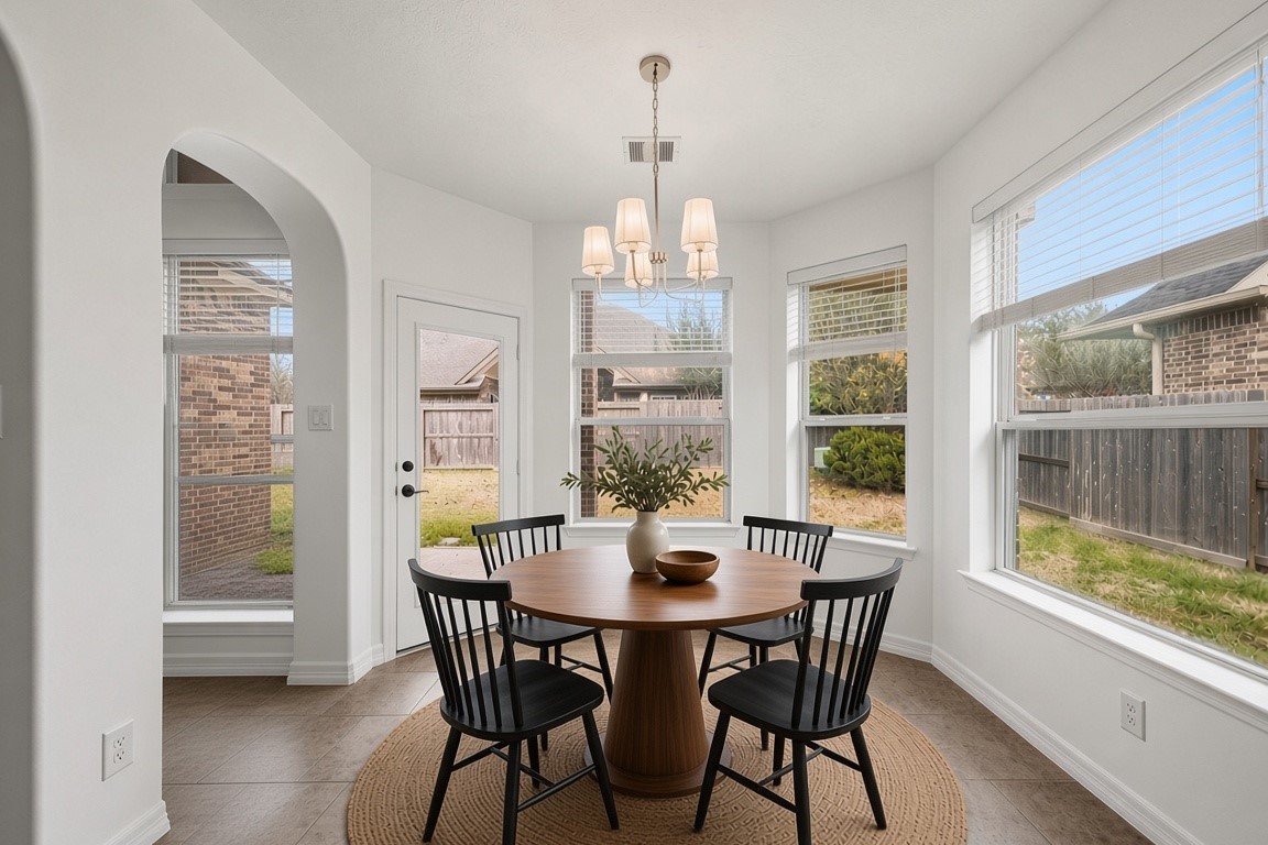 virtually staged - light filled breakfast room with patio access