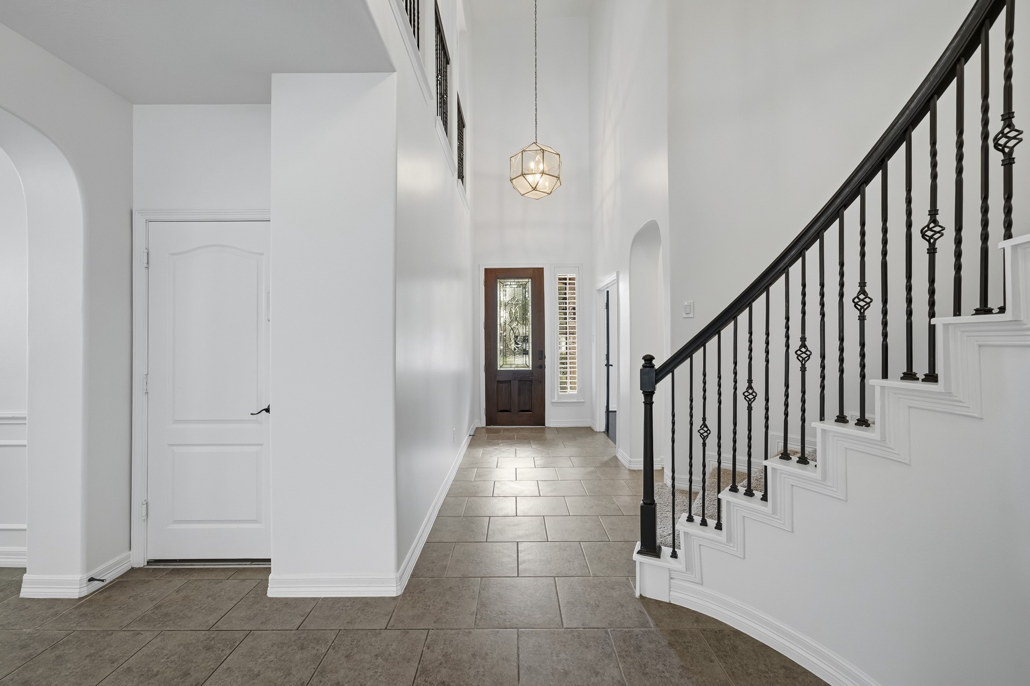 Entry facing toward the front door - access to 3 car garage is door on the left Entry facing toward the front door - access to 3 car garage is door on the left