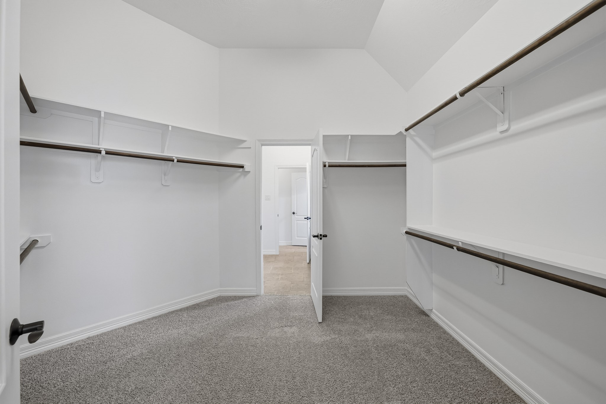 HUGE primary closet with laundry room access