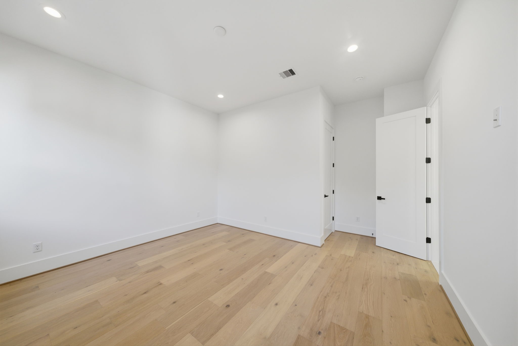 another view of one of the sizable guest bedrooms with large closet and adjoining bath. (Photos are of a previously completed home. Finishes are subject to change.)