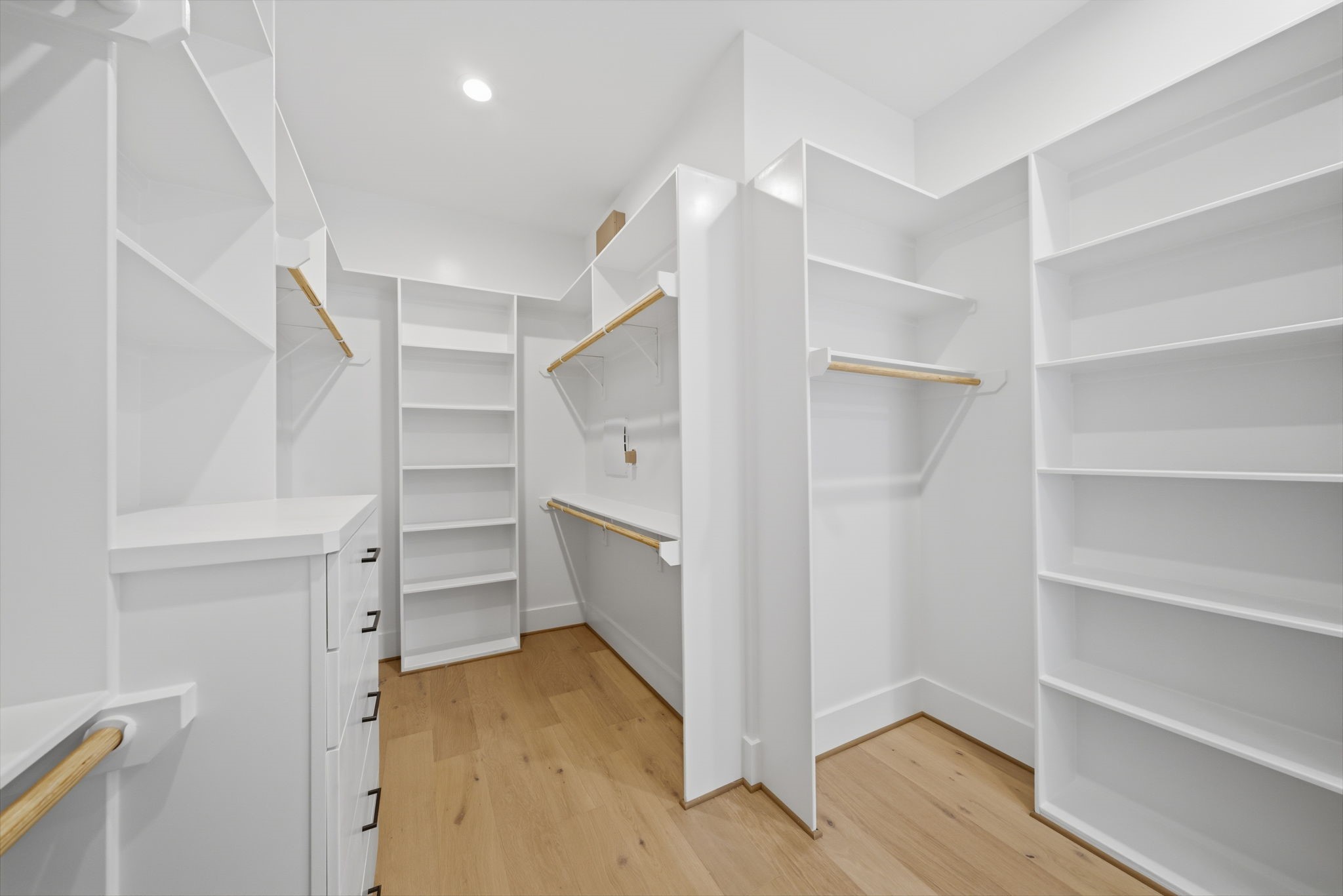 Alternate view HUGE walk-in closet with built-ins and plenty of space to keep organized. This is one of two master closets. (Photos are of a previously completed home. Finishes are subject to change.)