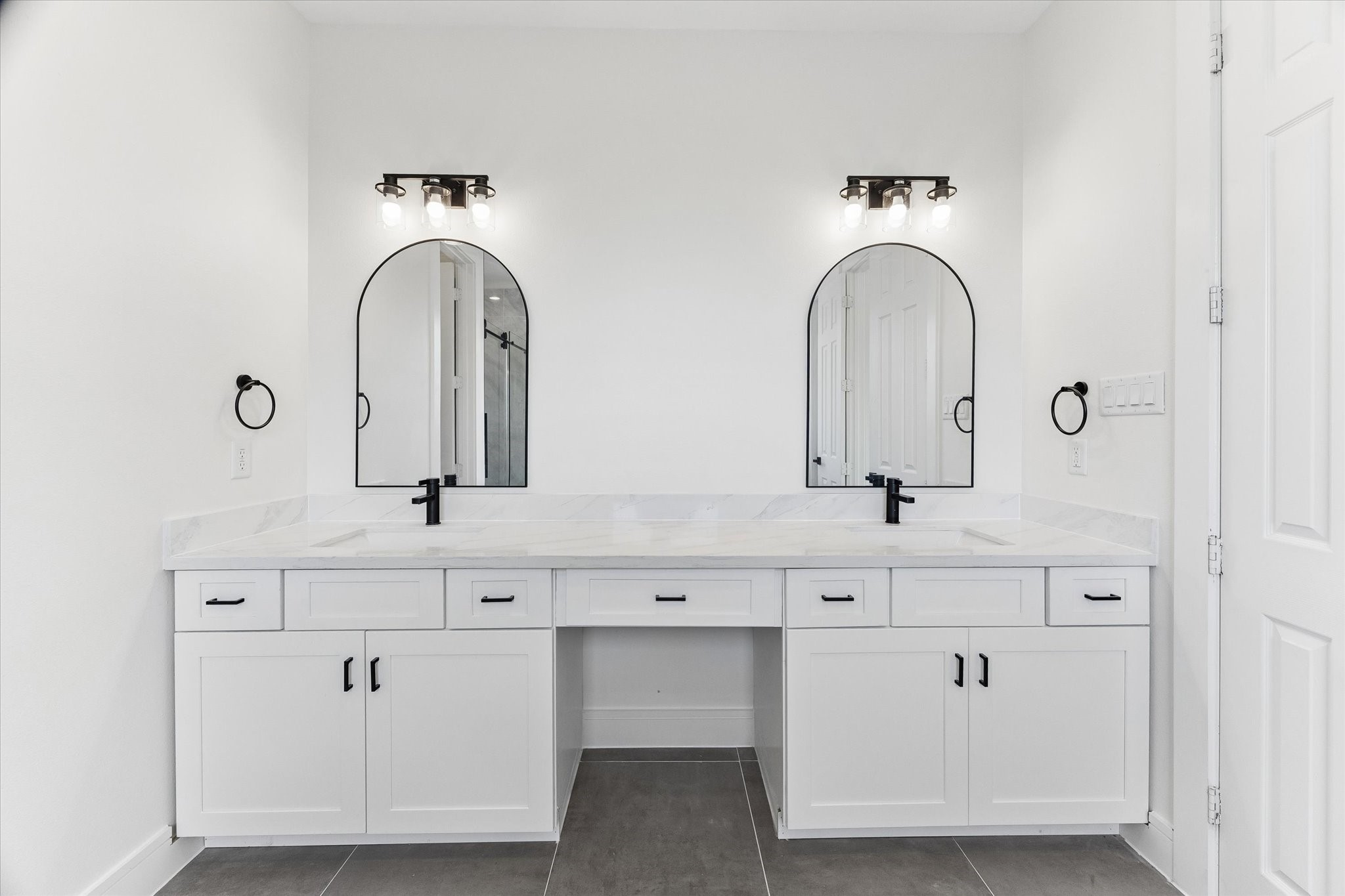 Primary bathroom with double sinks and make-up area.