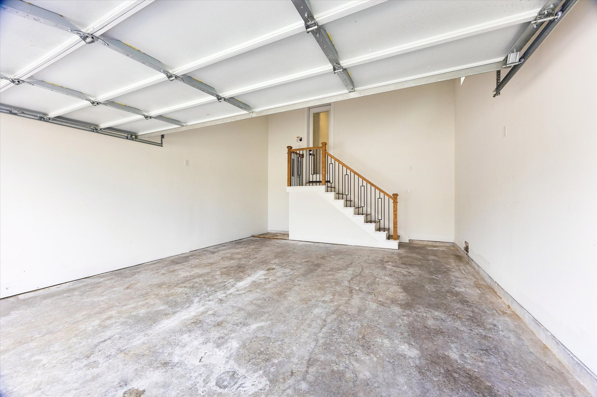 Double car garage with high ceilings to offer additional storage units.