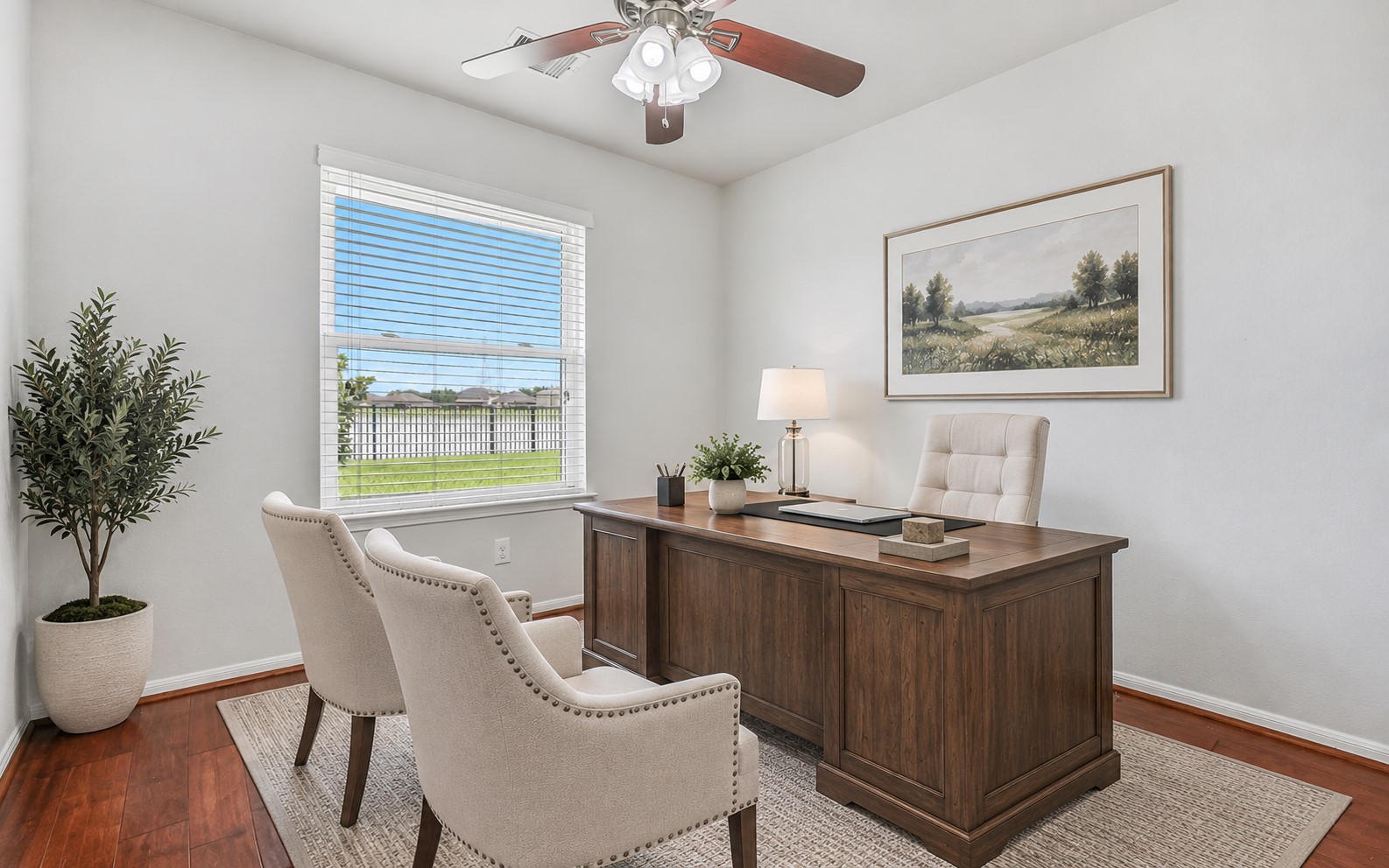 Tucked privately off the primary suite, this versatile study/flex room features wood flooring, fresh neutral paint, a ceiling fan & large window overlooking the backyard and pondideal for a home office, sitting room, nursery or exercise space. (virtually staged)