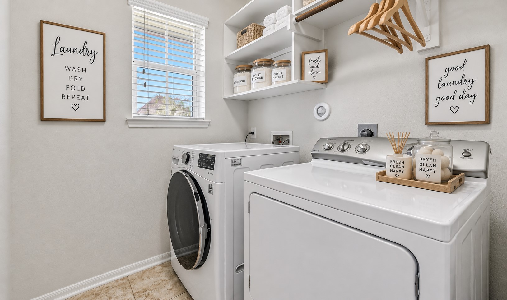 Conveniently located just off the kitchen, the dedicated utility room offers tile flooring, a window for natural light, washer and dryer connections, plus built-in shelving for laundry supplies and additional household storage.