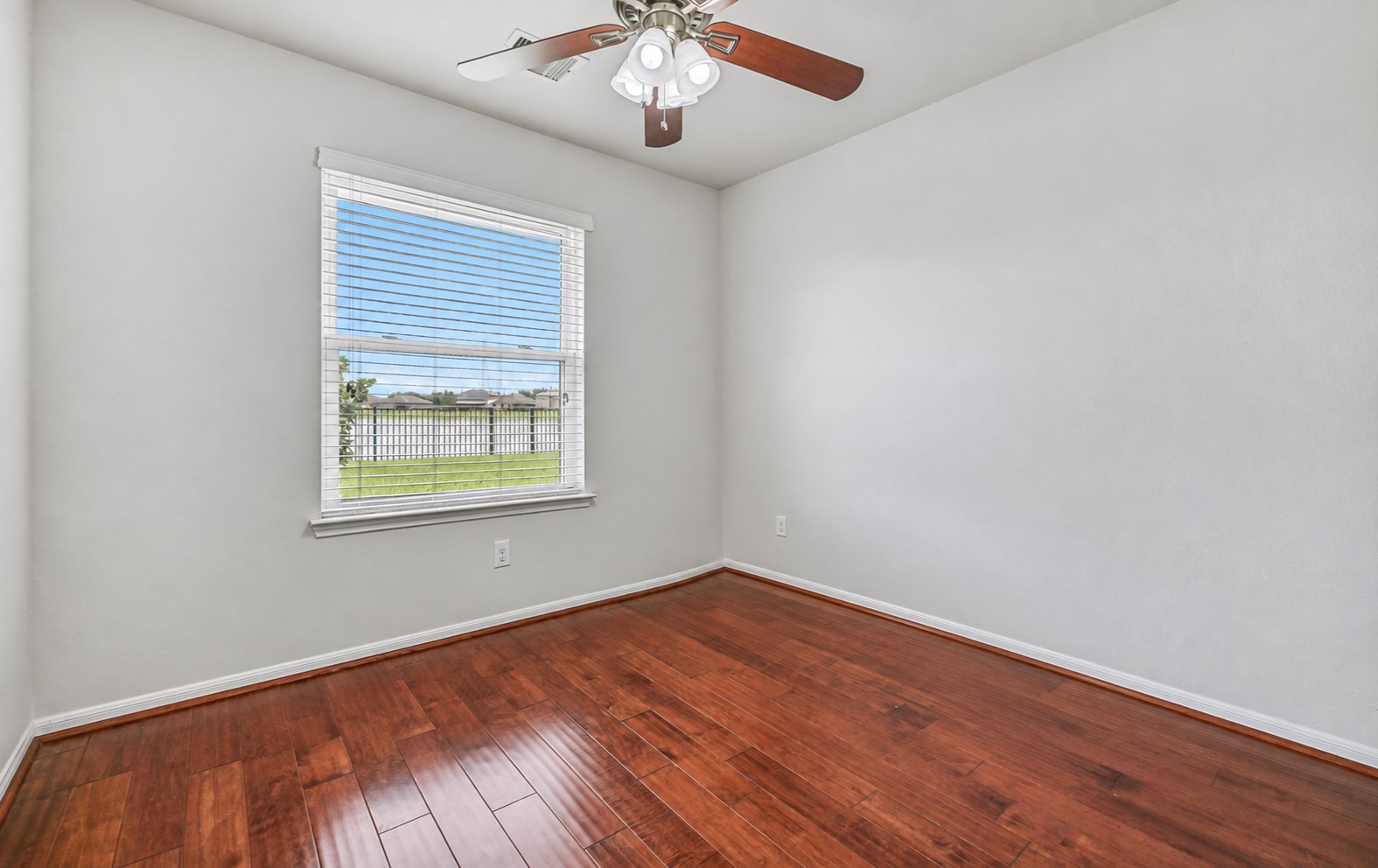 Tucked privately off the primary suite, this versatile study/flex room features wood flooring, fresh neutral paint, a ceiling fan & large window overlooking the backyard and pondideal for a home office, sitting room, nursery or exercise space.