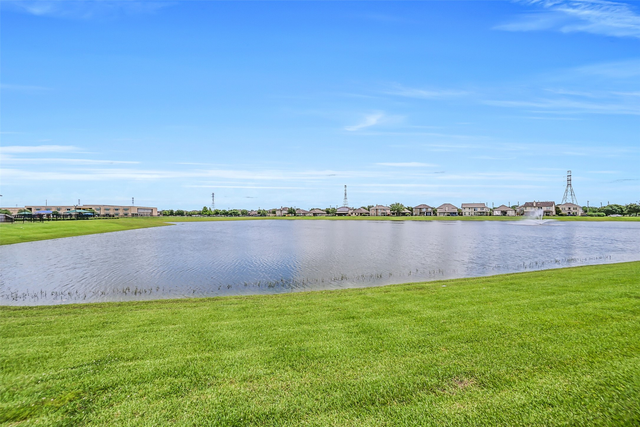 Enjoy this tranquil waterfront setting right from your own backyard! The expansive neighborhood pond creates a beautiful open backdrop, complete with a fountain and wide water views that can also be enjoyed from the primary suite & adjoining study.