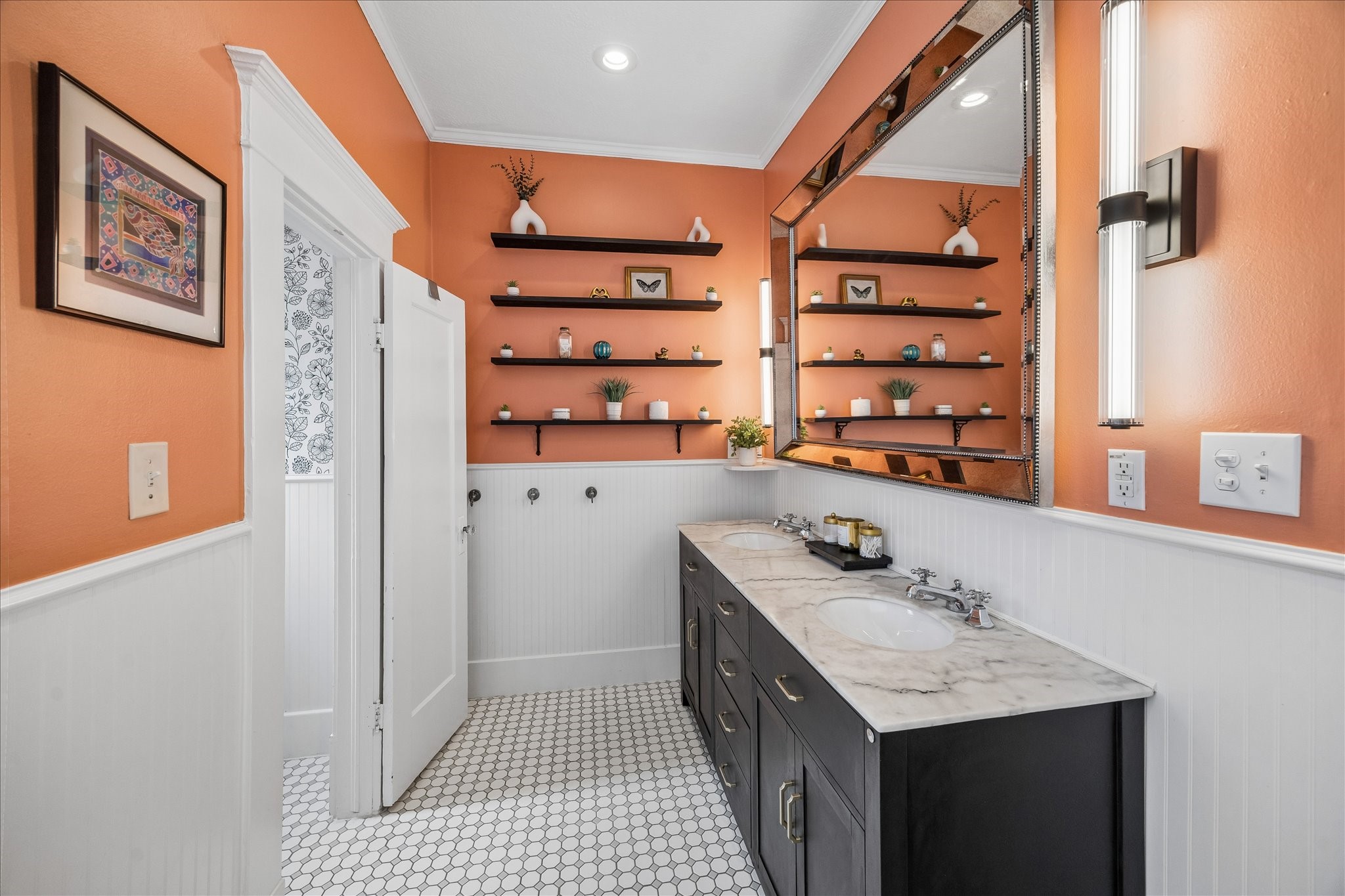 Expansive bathroom featuring a sleek double vanity.