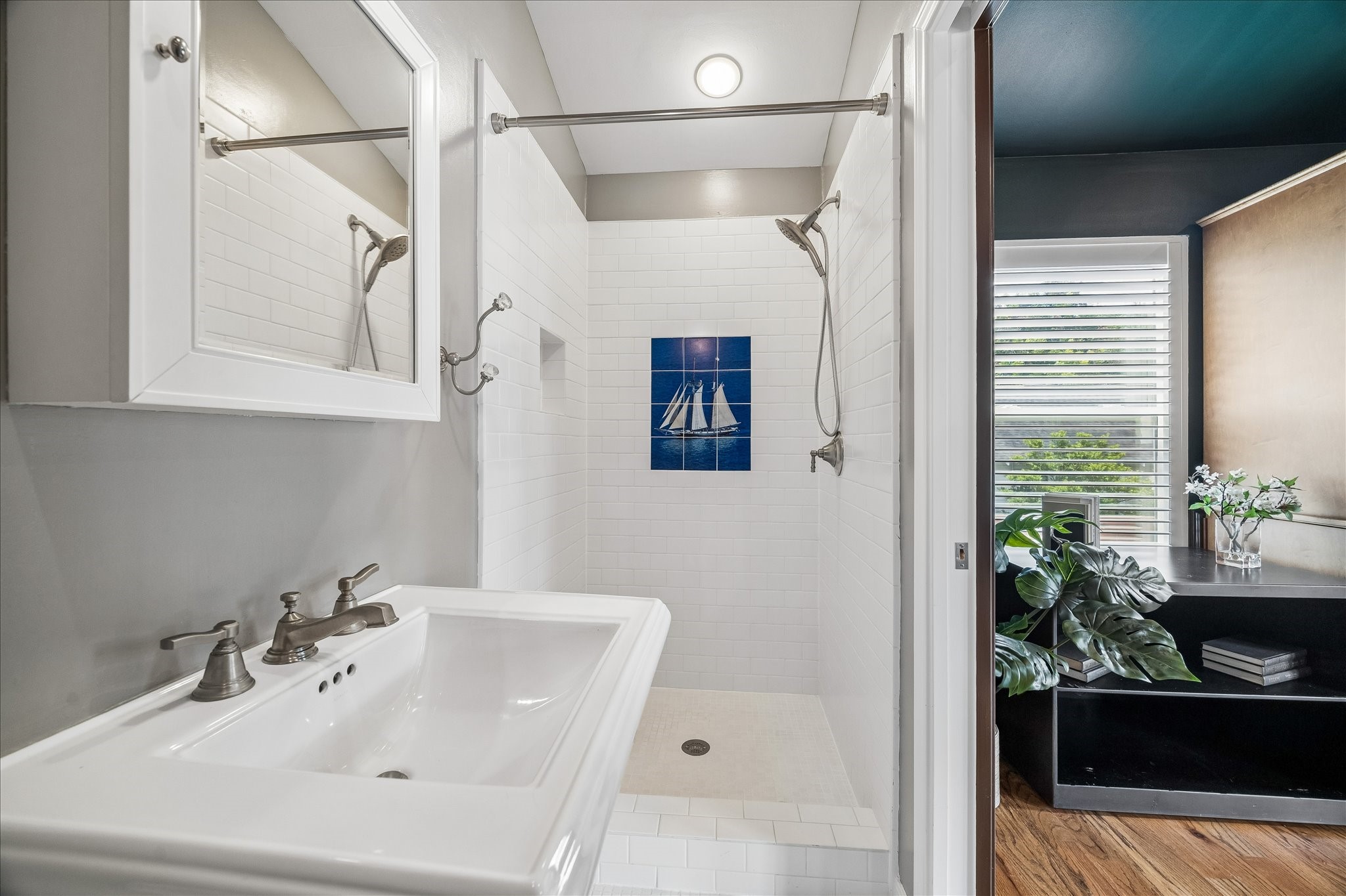 Stylish bathroom located in the versatile flex space above a creatively repurposed garage.