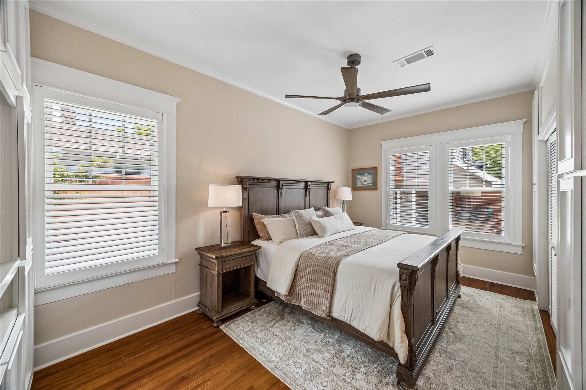 Abundant built-in storage enhances the bedroom's functionality.