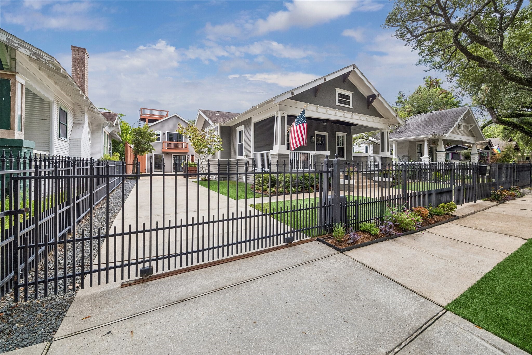 Secure automatic driveway gate for enhanced privacy and convenience. Welcome to Woodland Heights!
