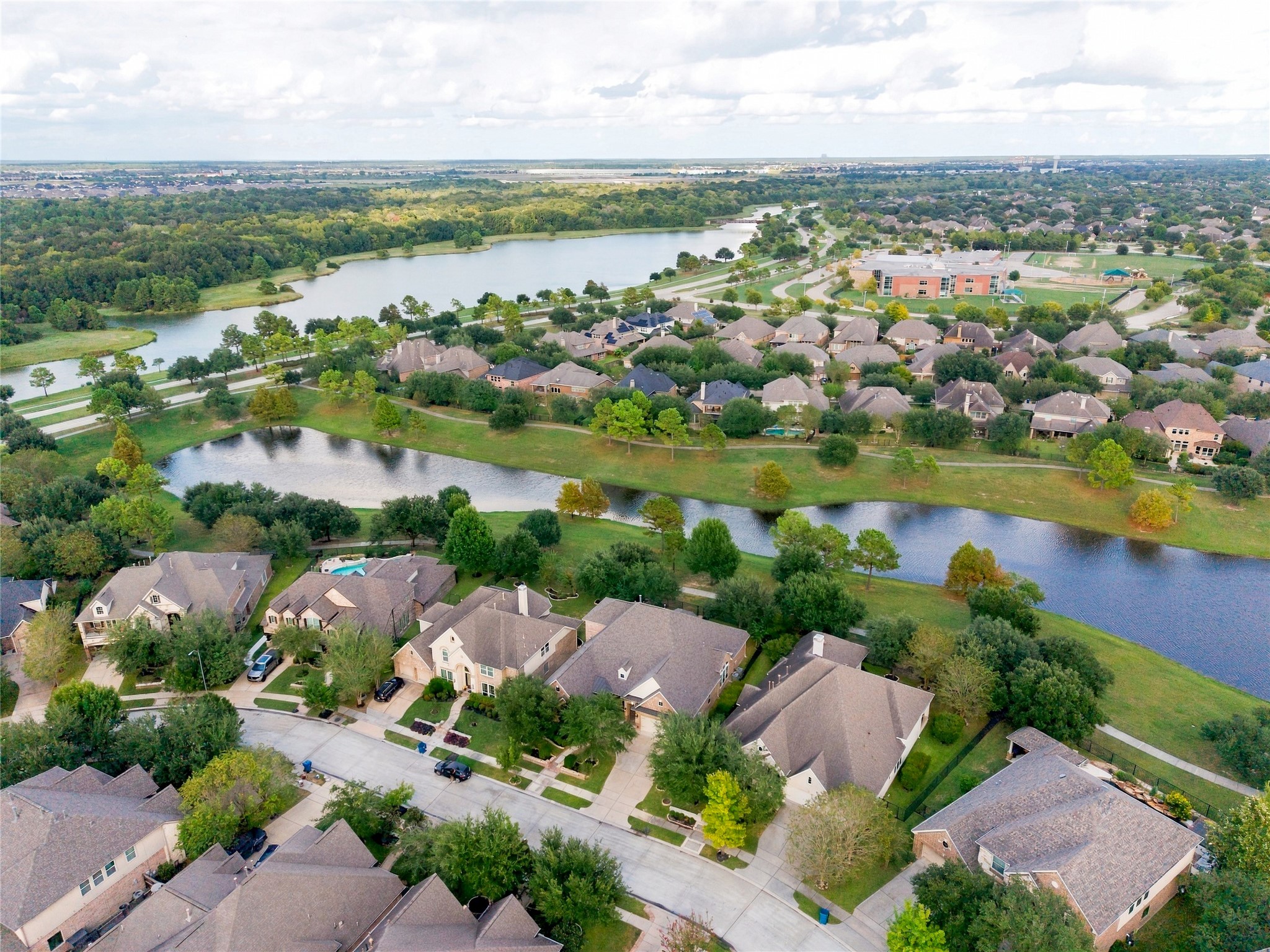 Aerial view of this remarkable home with waterfront surroundings!