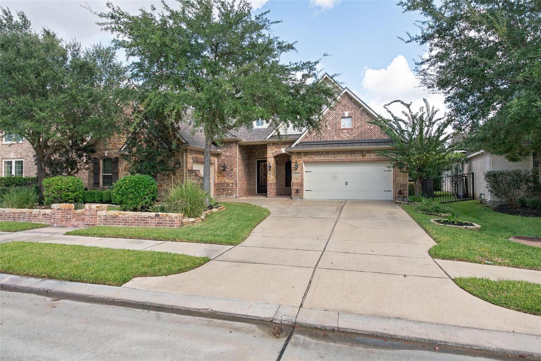 This home offers charming curb appeal with mature trees and beautifully maintained landscaping.