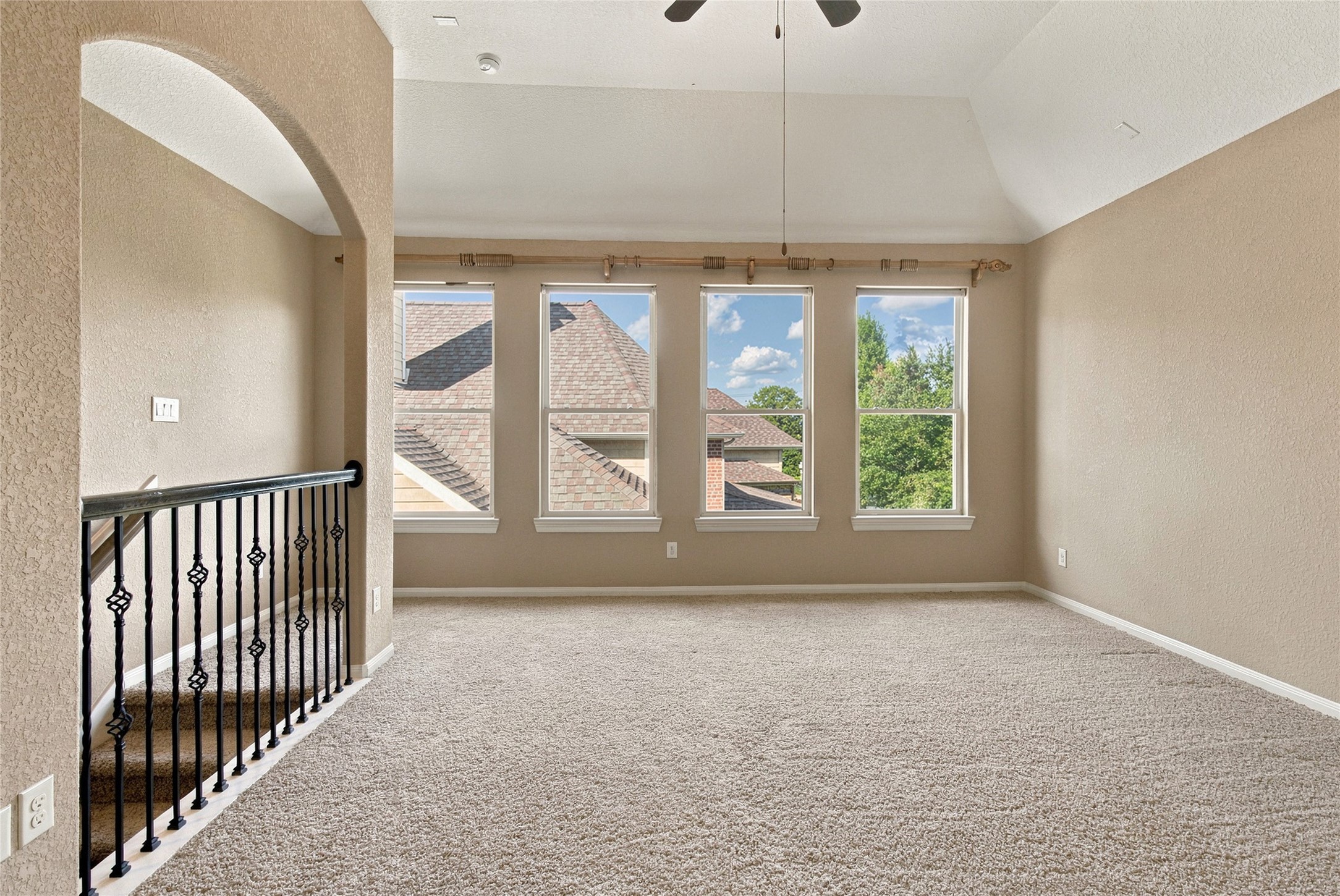 Another view of the spacious bonus room, offering endless possibilities for entertainment, hobbies, or relaxation.