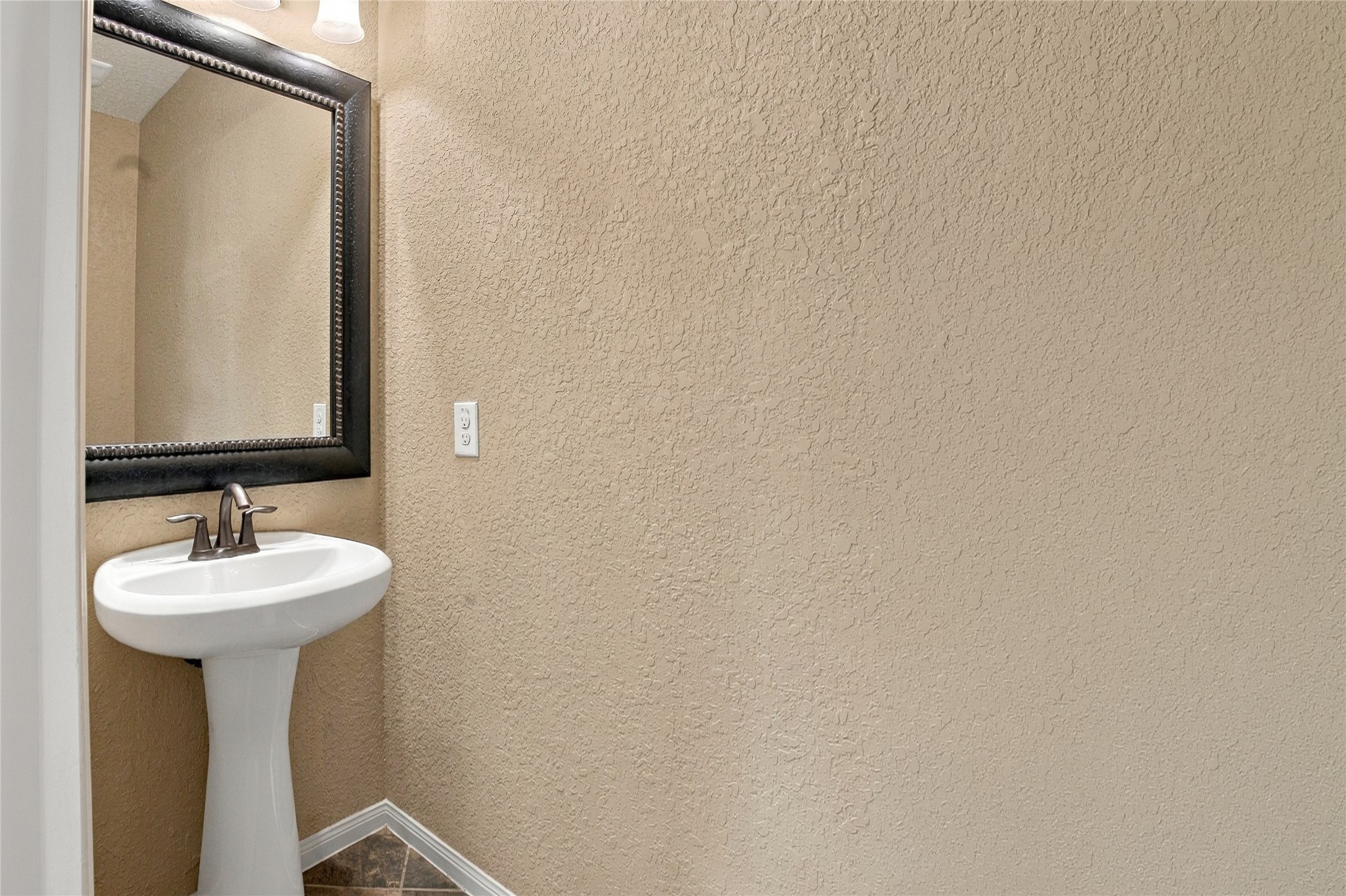 Convenient half bathroom located upstairs, providing added functionality for the bonus room.