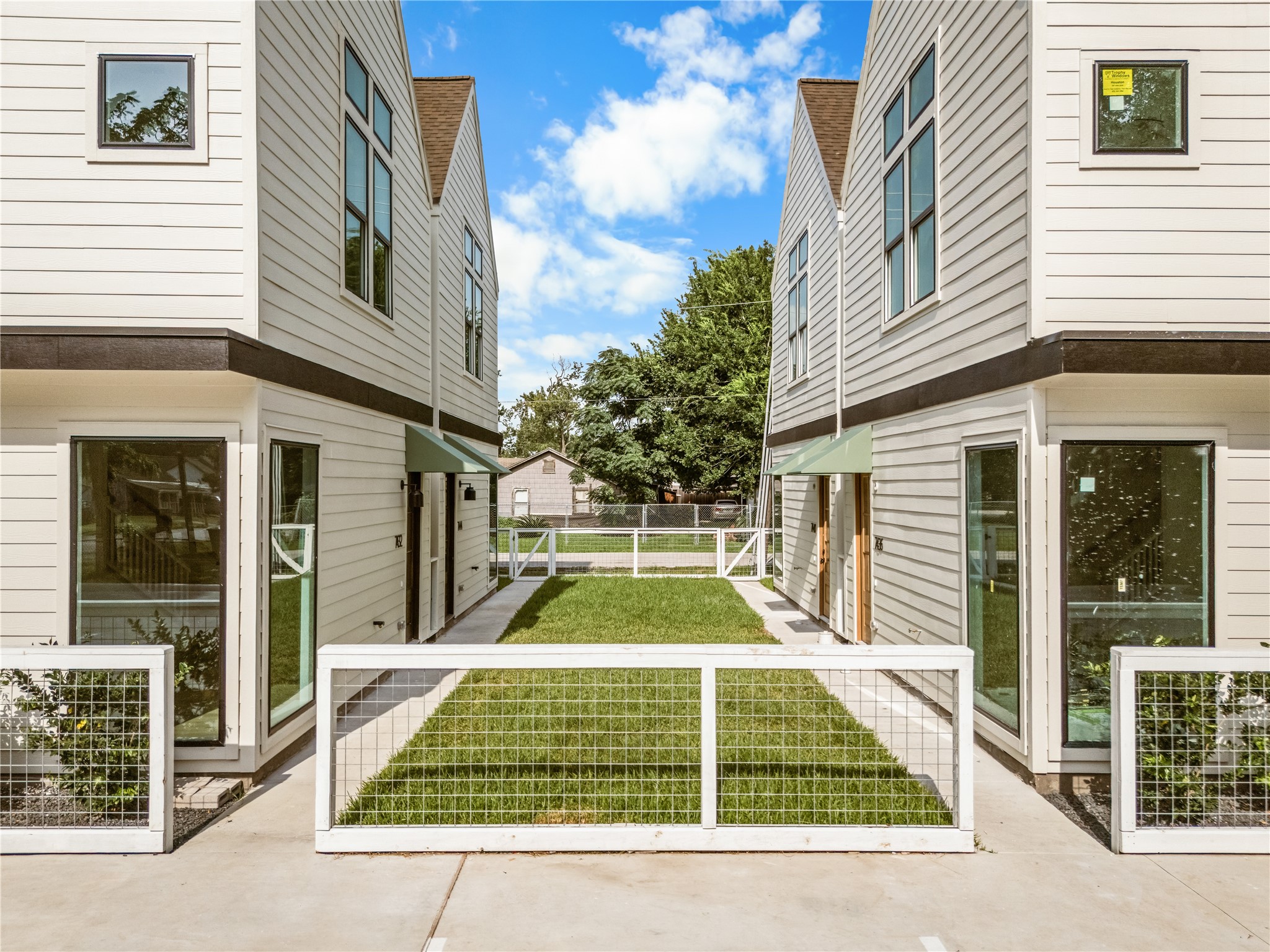 The courtyard pathway that connects it all  private feel in a community built for real life