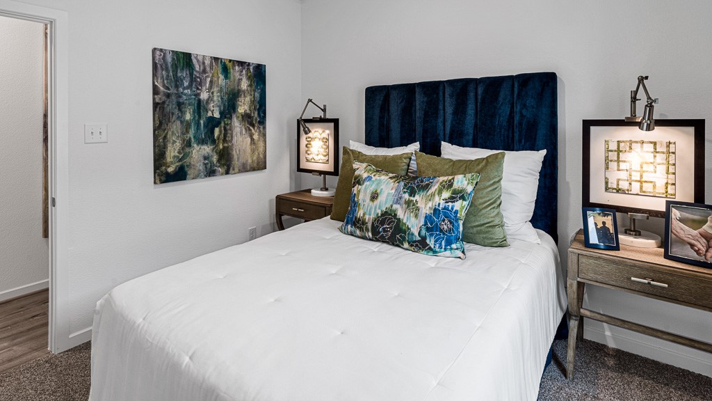 Bedroom 3 has a high end presence with designer white walls and warm gray premium carpeting.