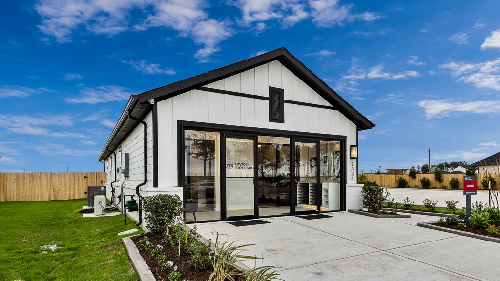 Excellent curb appeal with rock-lined landscaped beds lining the driveway and walkway adding softness, texture, and color.